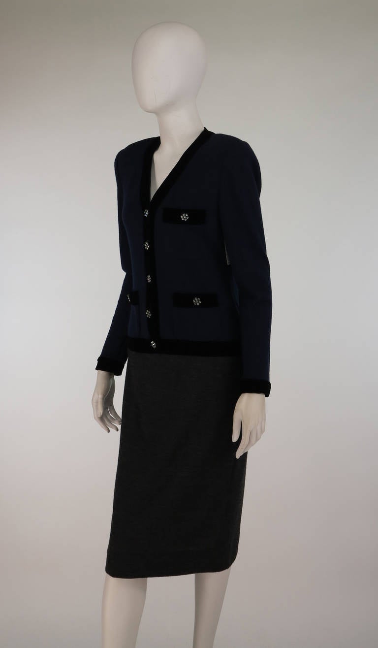 Miss O, Oscar de la Renta 1970s wool jersey dress...Classic style dress in navy blue and charcoal...Long sleeves, button front dress with 3 banded button through pockets at the front bodice...Attached skirt is slightly A line...Pull on style dress