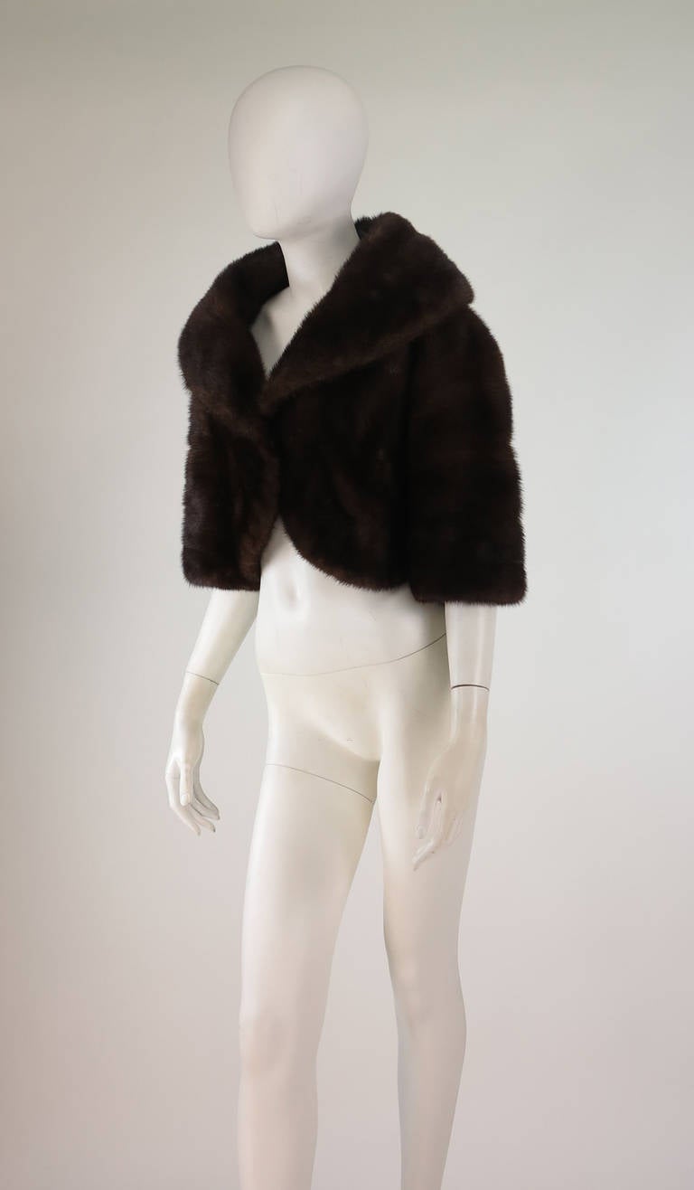 Dated Dec. 19th 1956, from Saks Fifth Ave.!  Cropped mink jacket in a rich dark brown....Open front jacket has a deep collar and elbow  length sleeves...Perfect to wear over your wedding dress...The fur is in excellent condition full and shiny...The