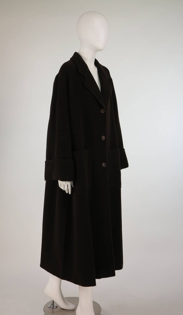 1990s pure wool coat labeled Vestimenta SpA, the Italian company that has produced clothes for some of the biggest designers, including Giorgio Armani, Calvin Klein and Emanuel Ungaro...Classic style in the oversize shape of the mid-late 1990s (no