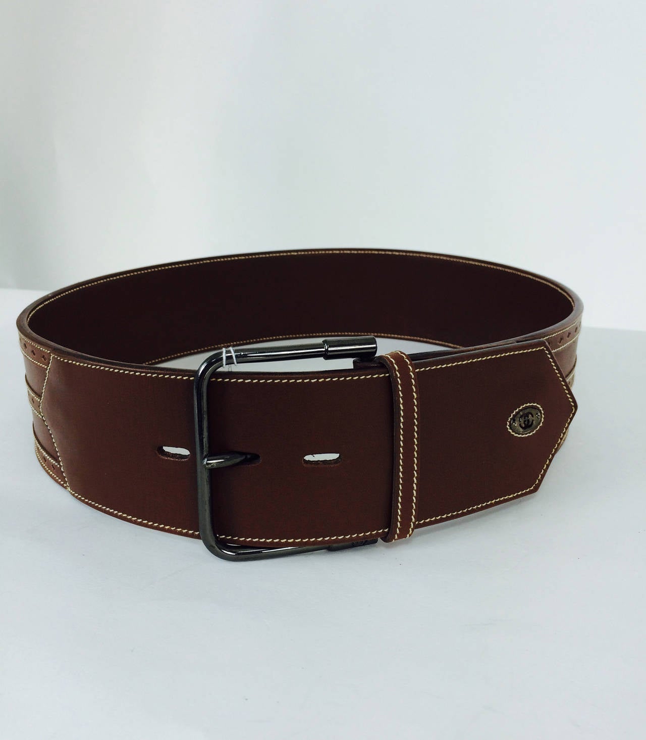Gucci chocolate brown wide leather belt, for your waist...Three top stitched bands of decorative leather run the length of the belt...The buckle is gunmetal...Marked 42, the belt is 36 1/2