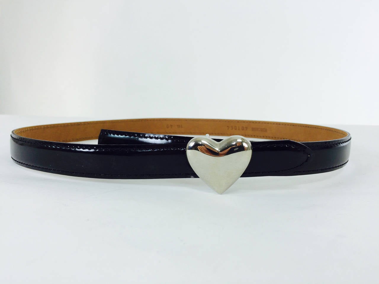 Moschino black patent belt with silver heart buckle...In excellent barely worn condition...33