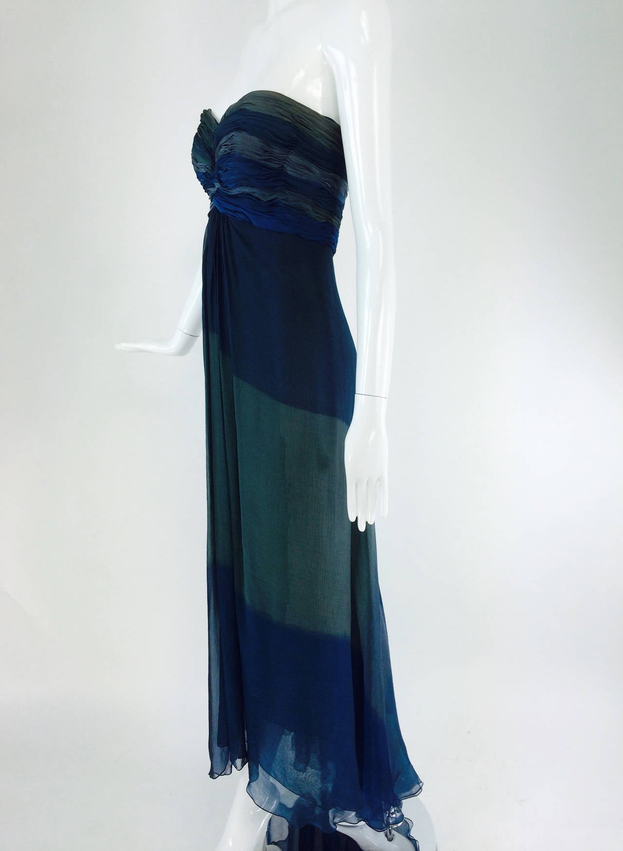 Oscar de la Renta teal tone on tone chiffon goddess gown 1970s...Strapless gown with a boned, ruched bodice...The column skirt is three layers of silk chiffon the outside is done in tonal areas similar to ombre dying, the shades of teal, aqua and