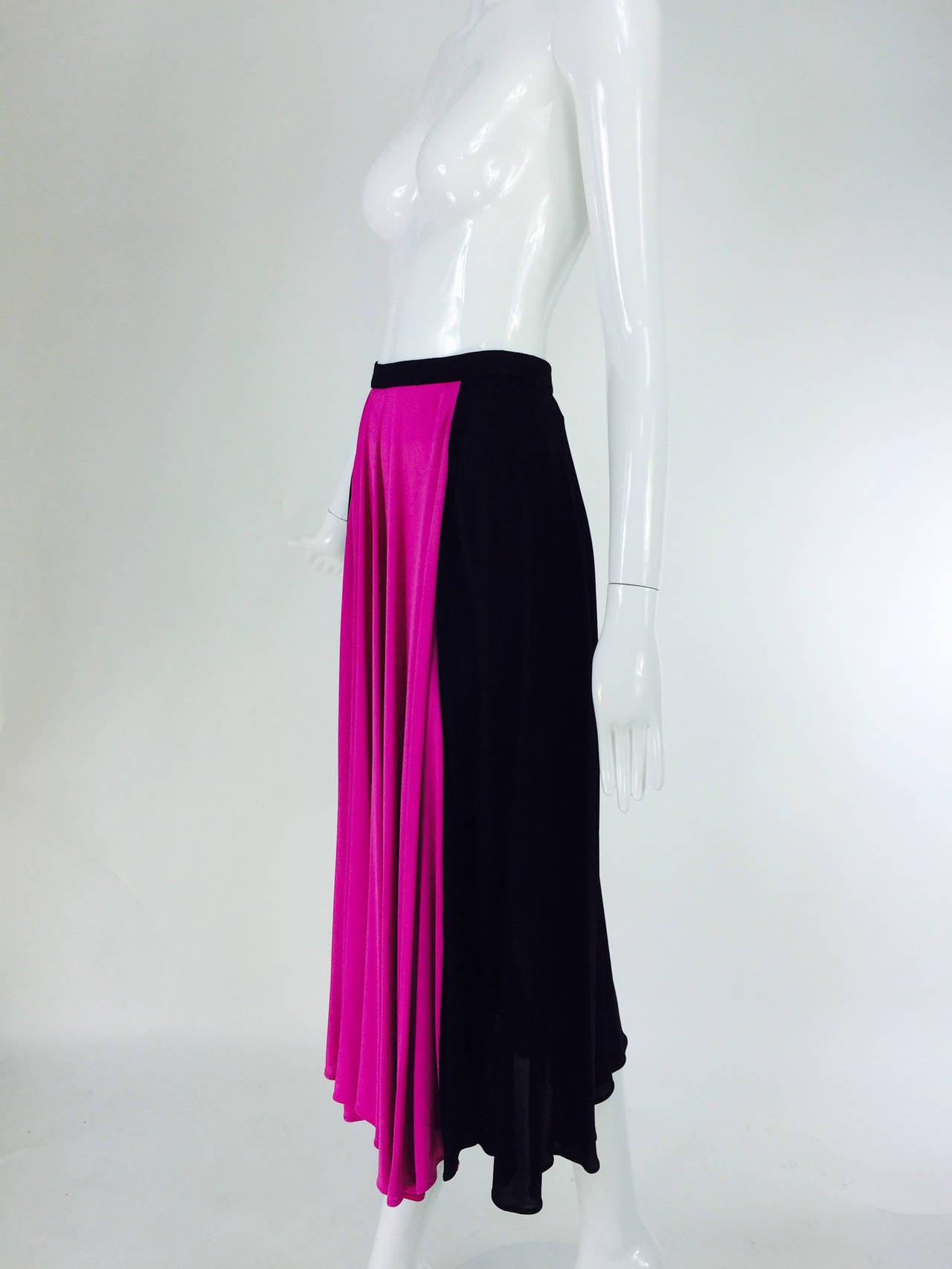 Yves St Laurent Rive Gauche black & hot pink jersey skirt 1970s...1940s influenced rayon jersey skirt in black & hot pink...The weight of the fabric gives this skirt nice drape & swing...Banded waist skirt has a front panel of hot