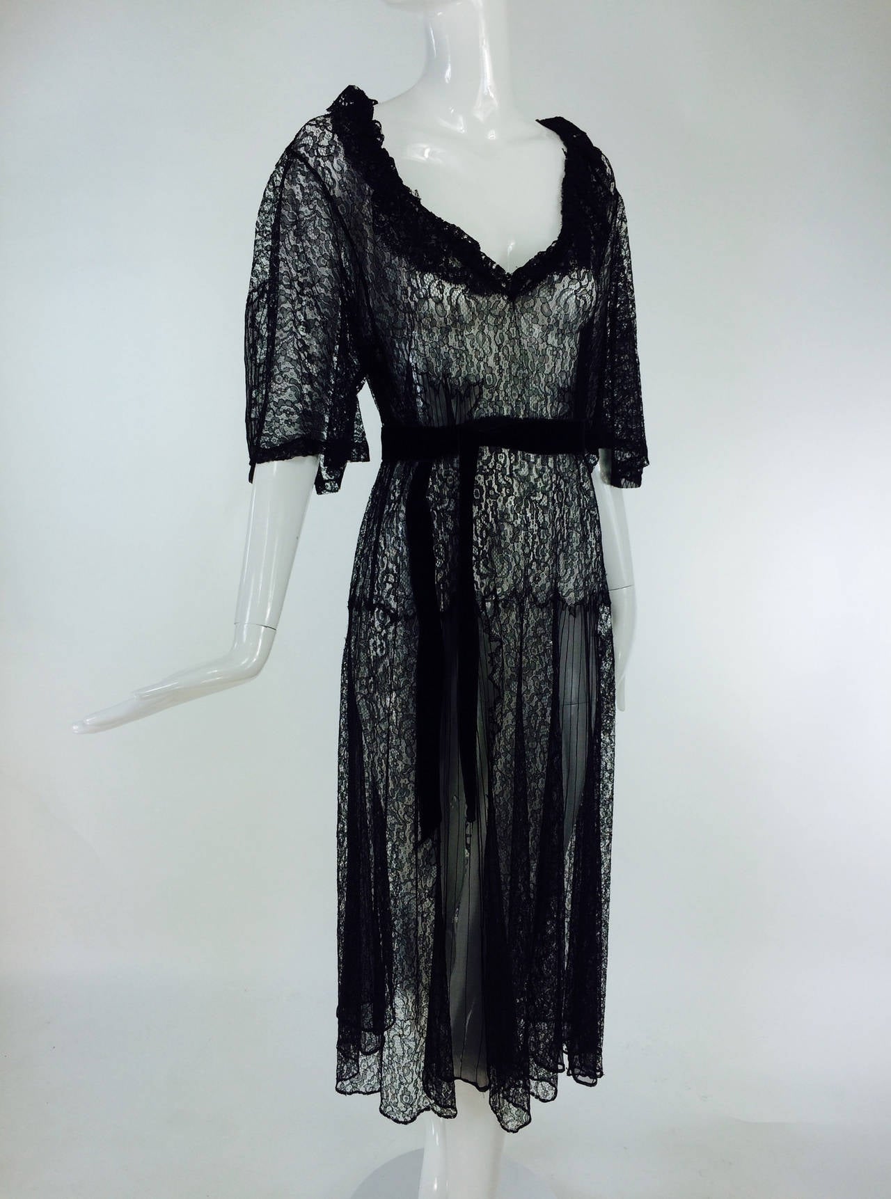 Black lace & chiffon dress 1940s...Shear black lace is expertly pieced and finished making this an unusually beautiful dress, the deep open neckline is trimmed in a delicate ruffle, it bridges the back of the neck creating a deep V back...The