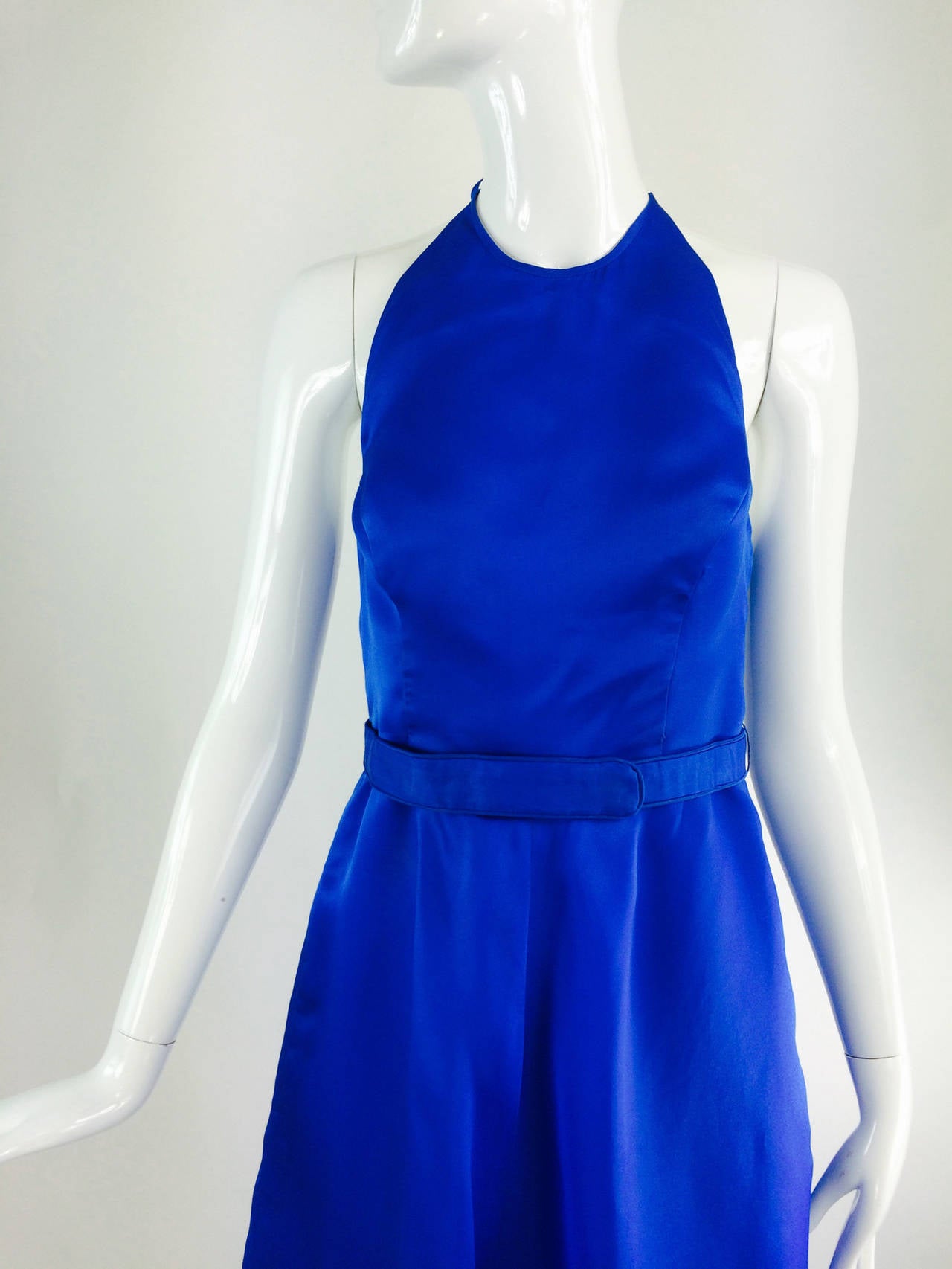 Fiandaca cerulean blue silk halter neck shaped hem gown 1990s...Fitted bodice gown has princess seaming at the front, the back dips low, the halter neck ties at the neck back with delicate silk ties...The skirt of the dress is bias cut and dips low