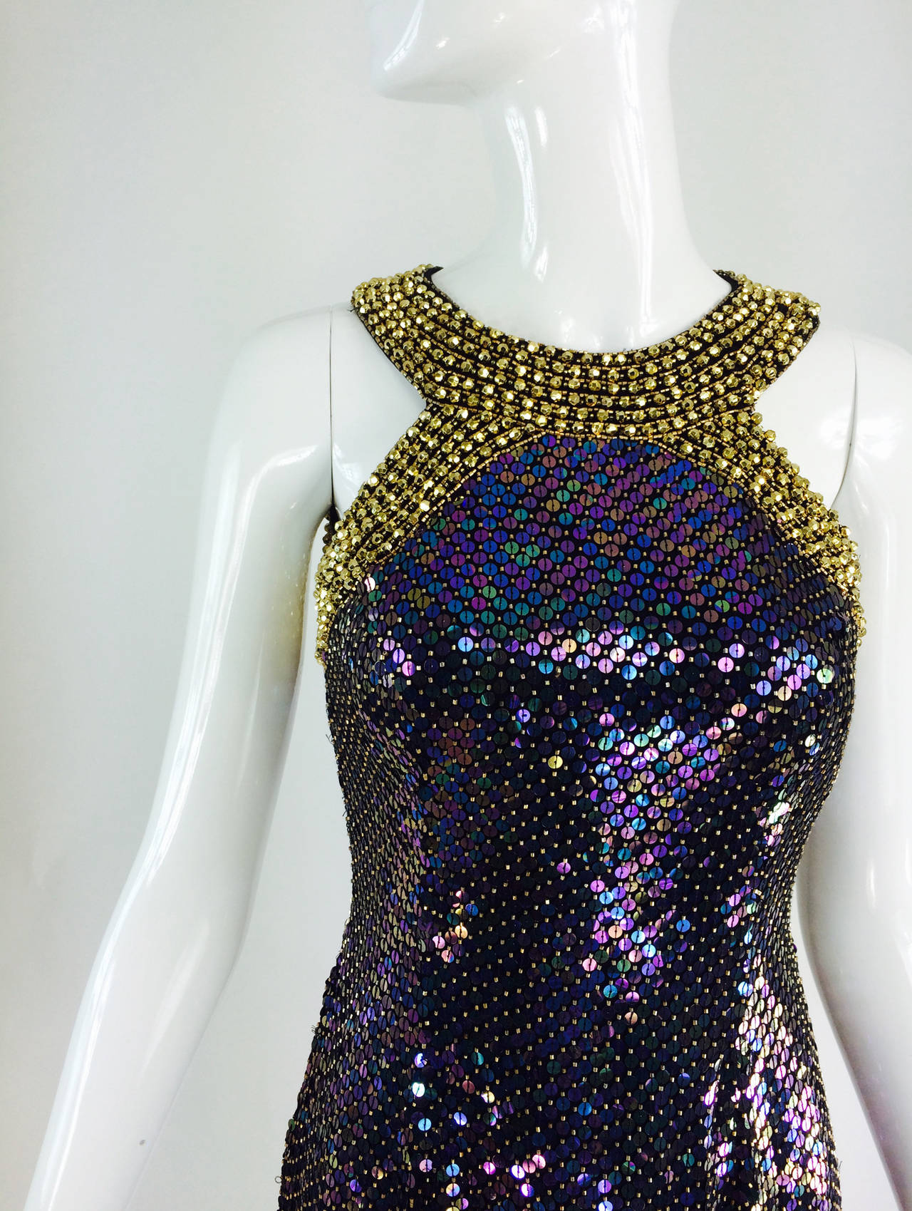 Oleg Cassini gold beaded halter neck iridescent sequin gown  1980s...Fitted gown with gold beaded halter neckline...Iridescent sequins are interspersed with gold beads on this gown that really shimmers...The halter neck is done in faceted gold beads