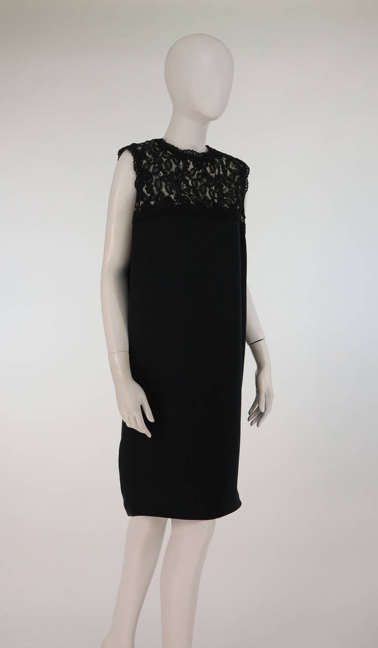 Bill Blass sac style, crepe & lace little black cocktail dress...Simple and chic dress has a black Guipure lace bodice (underlined in ivory) with black crepe dress which is slightly gathered at the back (below the lace bodice)...Fully lined...Closes