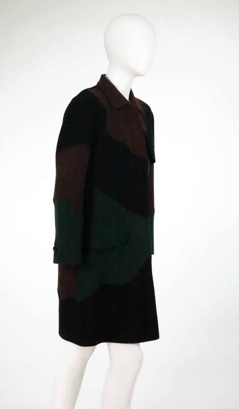 Laura Biagiotti pieced colour block double face wool coat...Wavy bands of colour are individually pieced together, in black, chocolate brown and dark forest green...Unlined coat has a placket front (hidden buttons), two flap front 