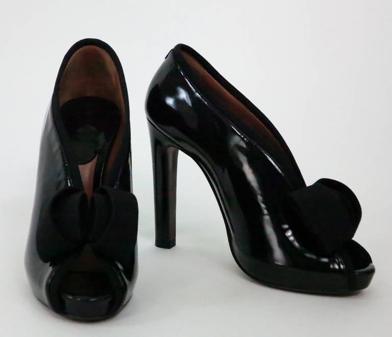 Georgio Armani black patent leather open toe tuxedo bootie new in the box, never worn...Size 36M EU...Slip on style, high vamp, double black gros grain bow at front, open toe, shapely heel...Retailed for $750.