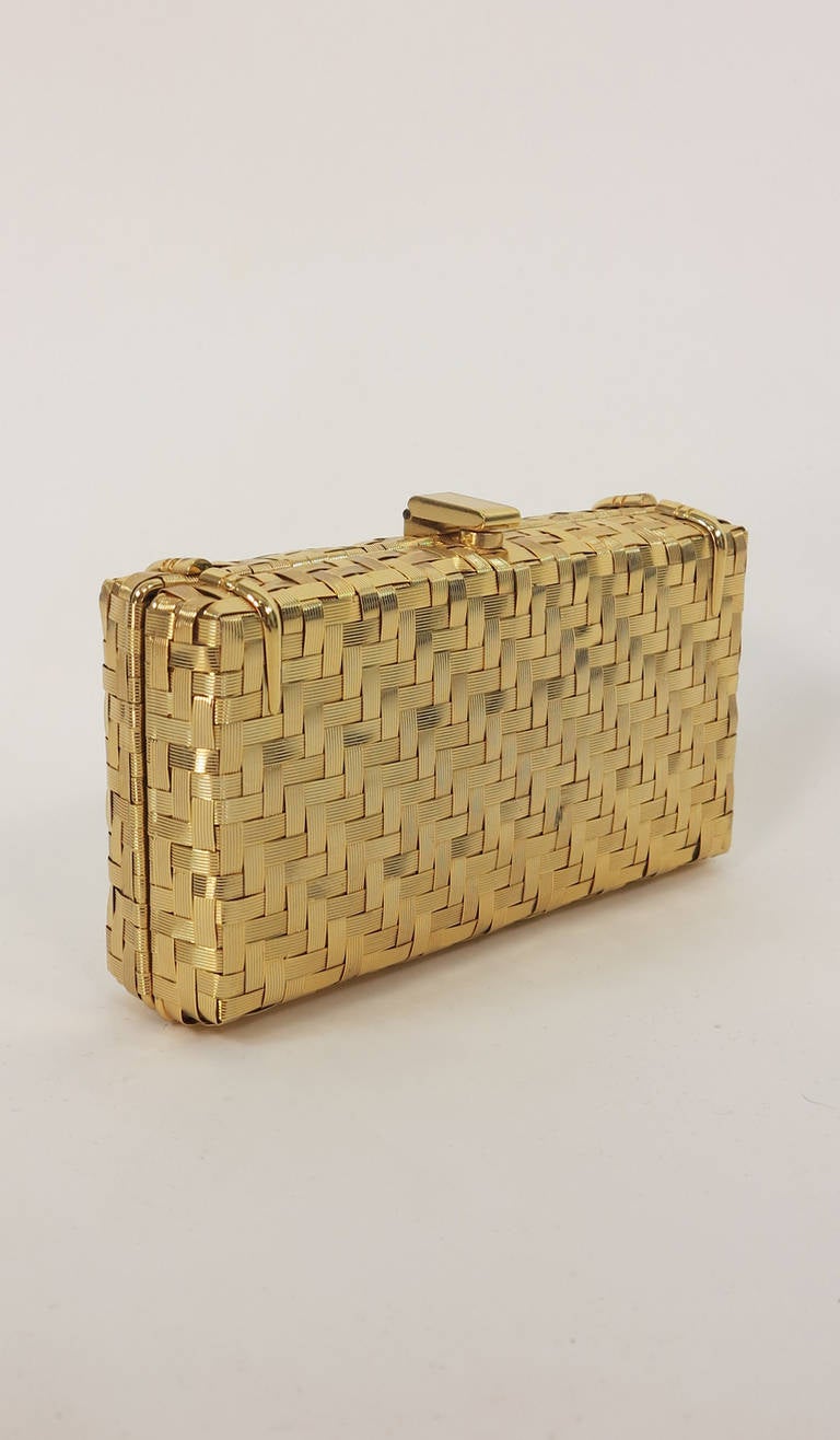 1970s Rodo gold metal basket weave evening bag...From the 1970s this structured bag is lined in gold leather and features a long shoulder strap that can be used or hidden inside...Single open inside pocket...

All accessories are carefully checked