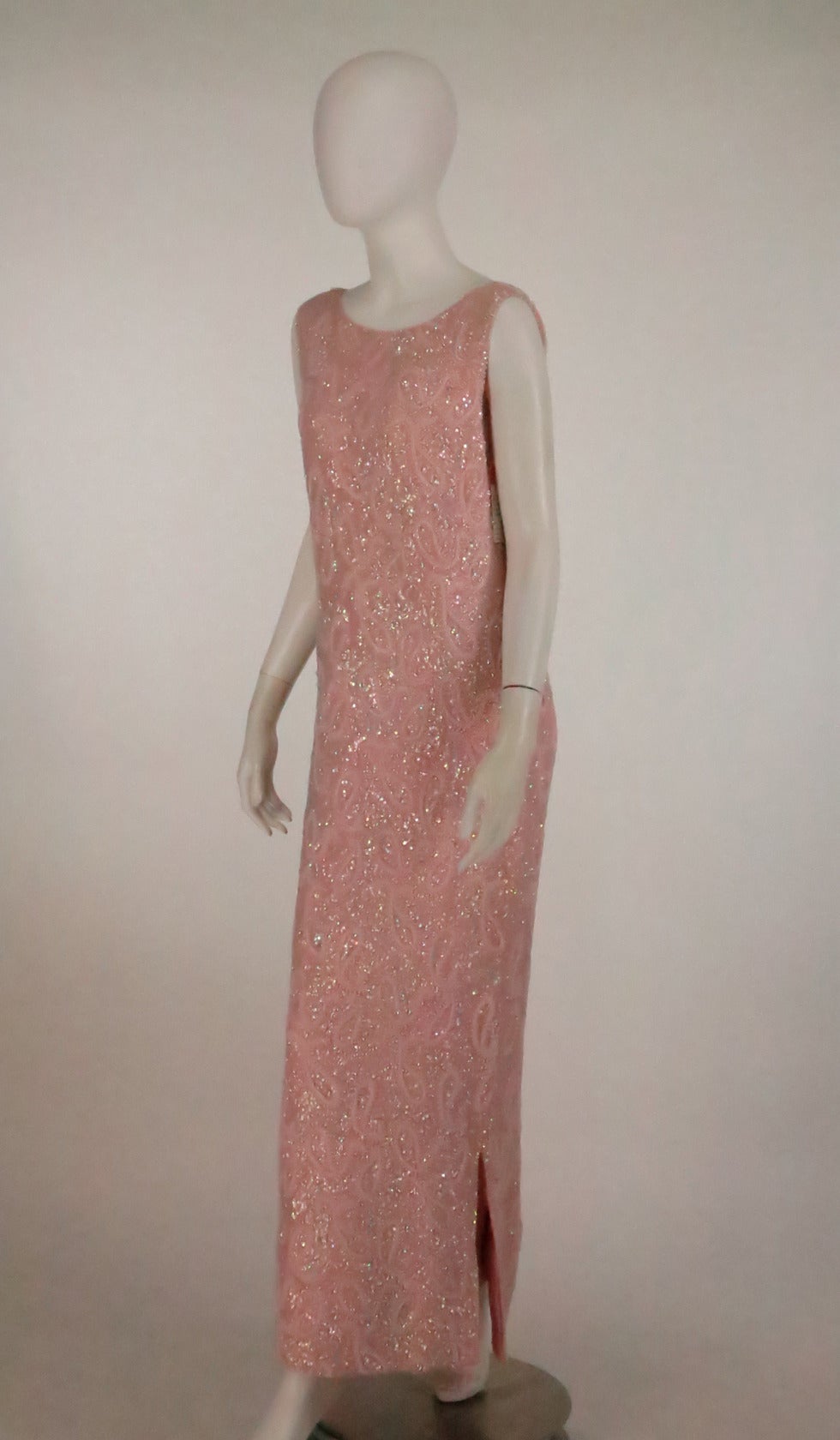 This gorgeous evening gown from the late 1950s is totally encrusted in beads and sequins + pearls, chic pale pink knit (probably fine wool)  has hand sewn glass beads, sequins & faux pearls…It features a low scoop neckline and a deep low back…The