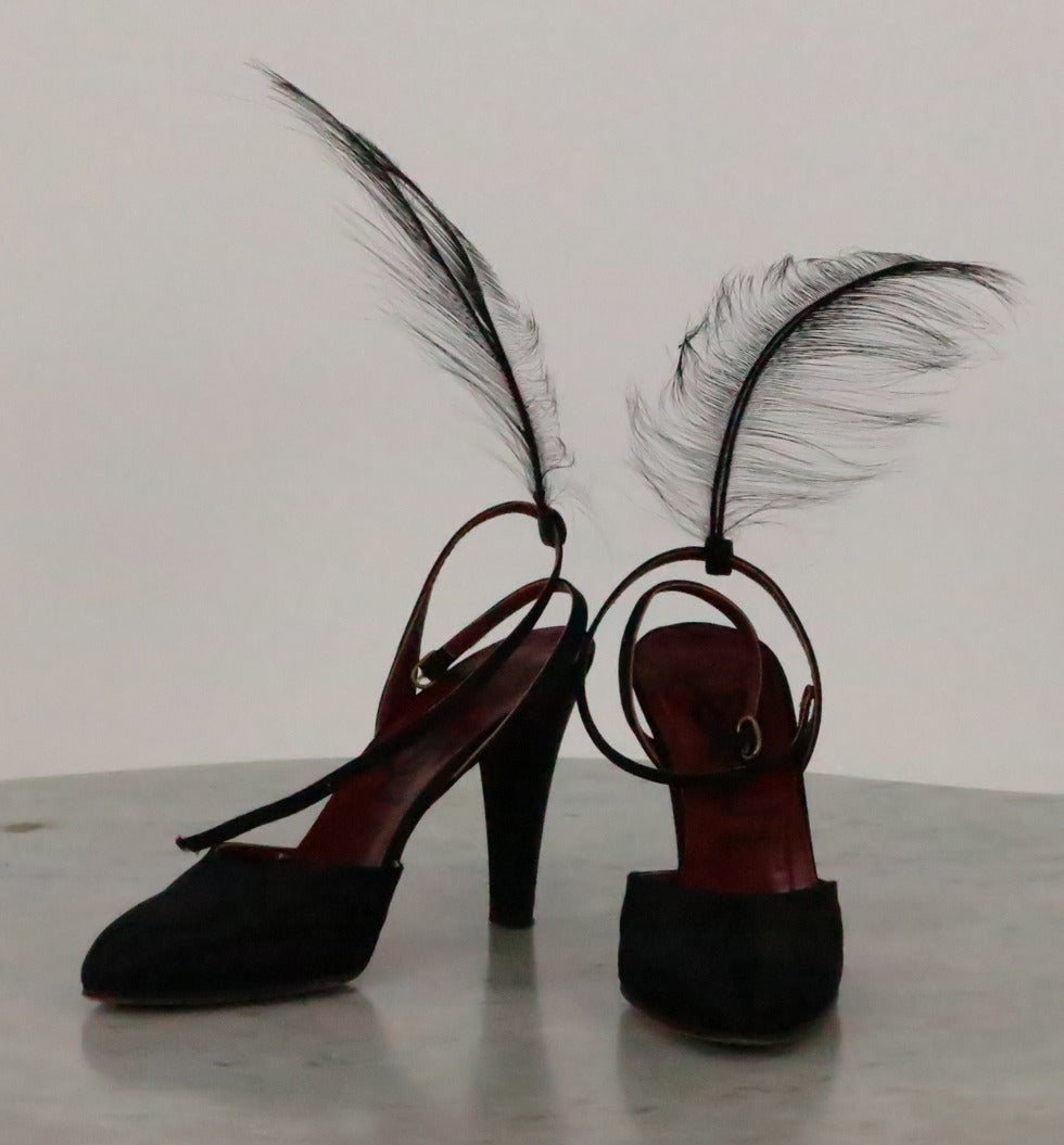 From the 1970s black silk ankle wrap strap heels…With the original Bird of Paradise feather attachments for the back of the straps(these are removable via a silk casement)…Beautiful and unusual shoes in very good condition…Marked size 8N