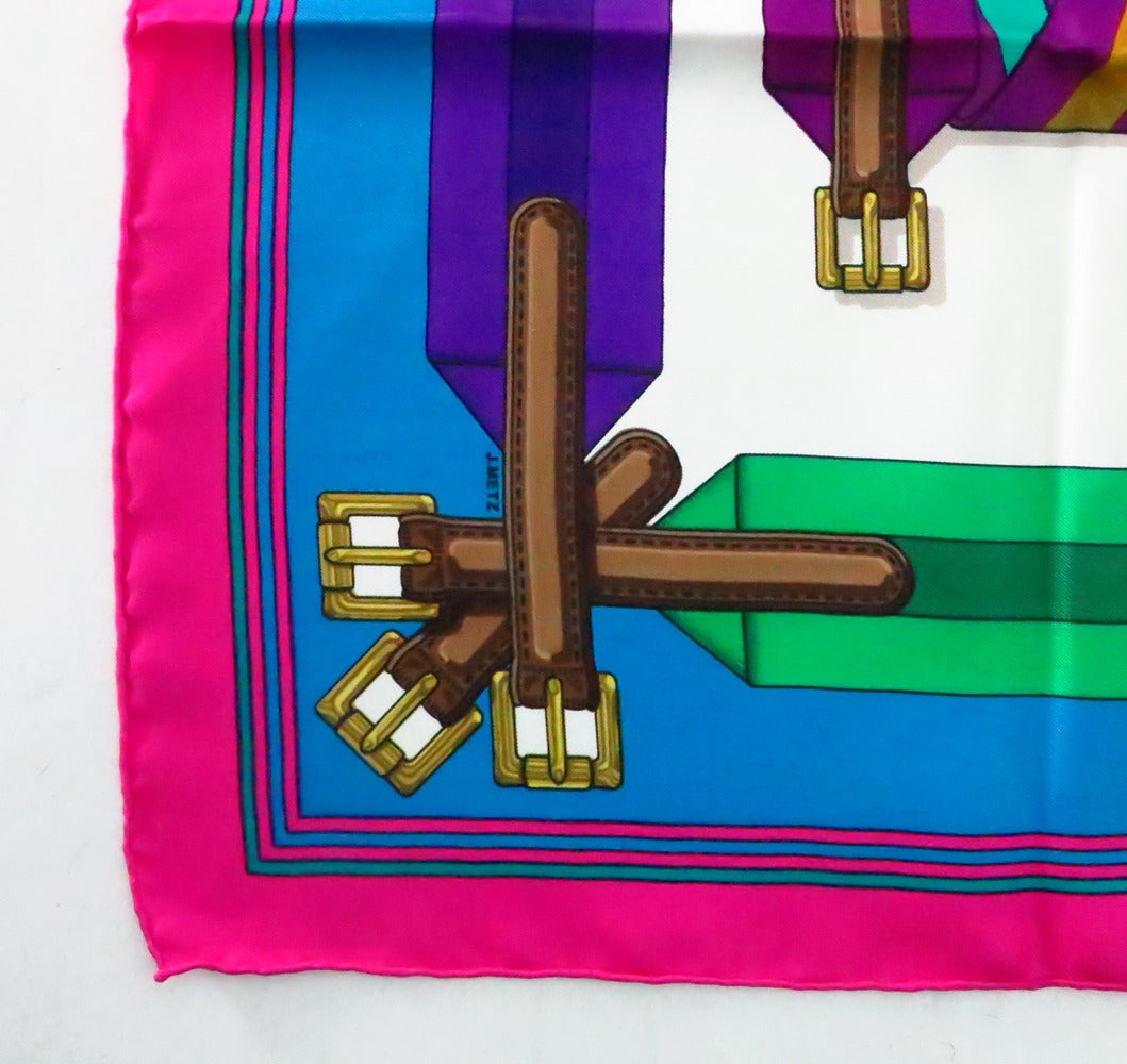 Hermes silk twill scarf print of saddle cinch buckles by J. Metz ...In barely used condition, colours are bright and hand rolled edge is plump...

Measurements are:
36