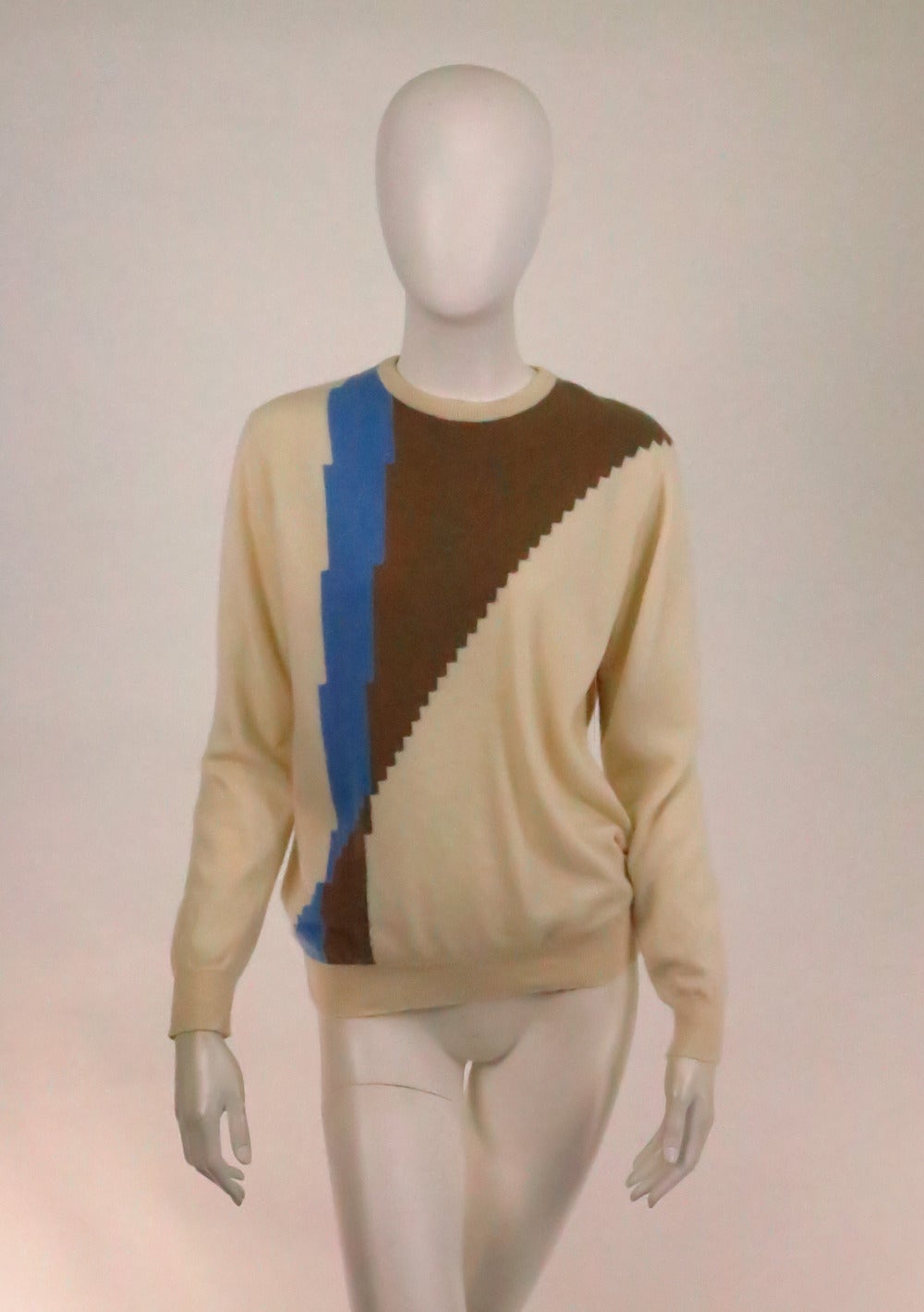 From the 1970s,James Pringle of Scotland, colour block pull over sweater...Creamy off white with pale cocoa & blue intarsia knit...Round neckline, long sleeves with ribbed cuffs, ribbed hem...Fits like a S-M

In excellent wearable condition... All