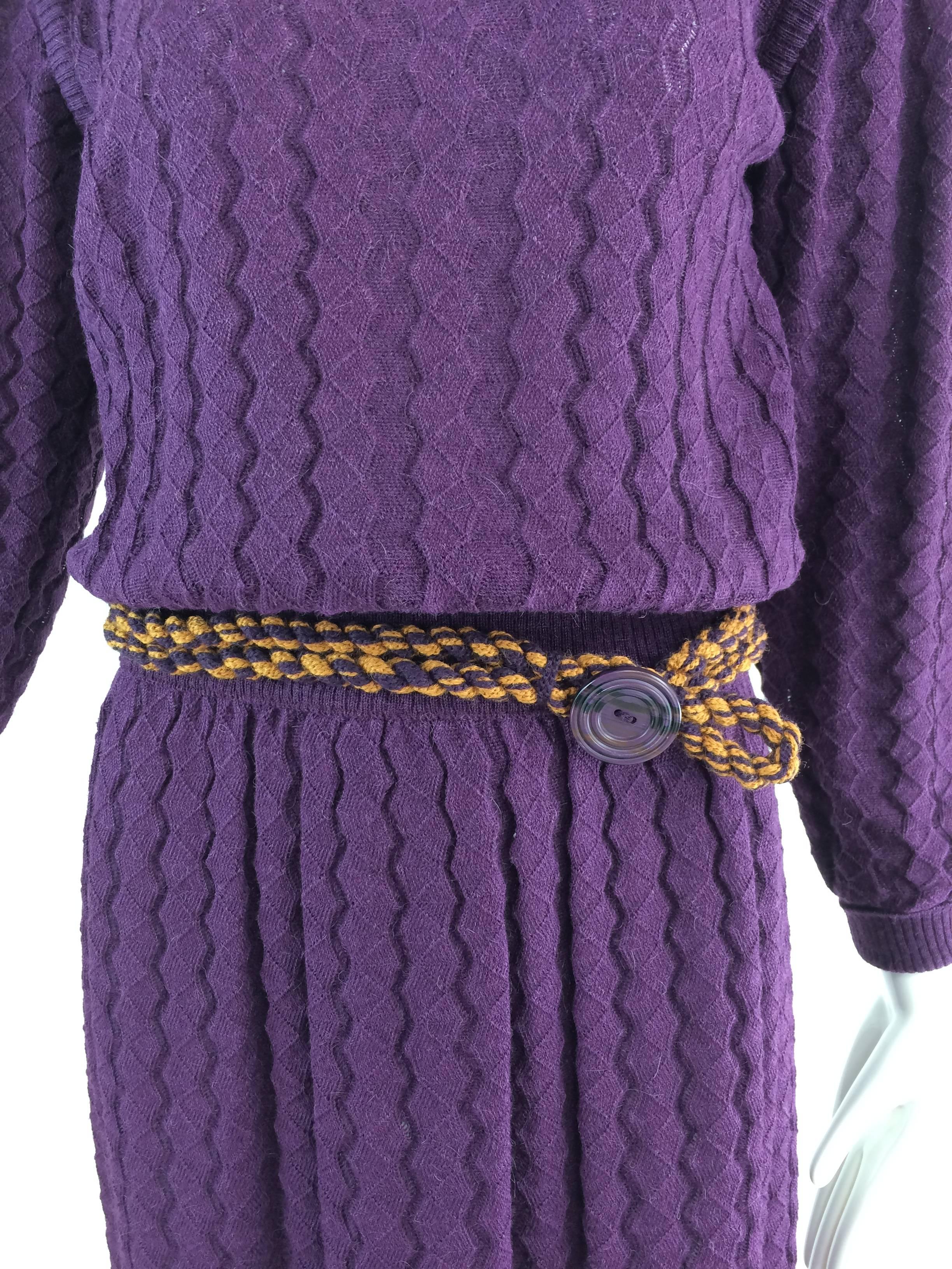 Missoni plum cable knit long sleeve dress & braided belt...Cable knit alpaca in a sort of honey comb pattern, this dress is soft...Pull on style with ribbed neckline, and ribbed shoulder bands, long sleeves with ribbed cuffs...The dress has a cased