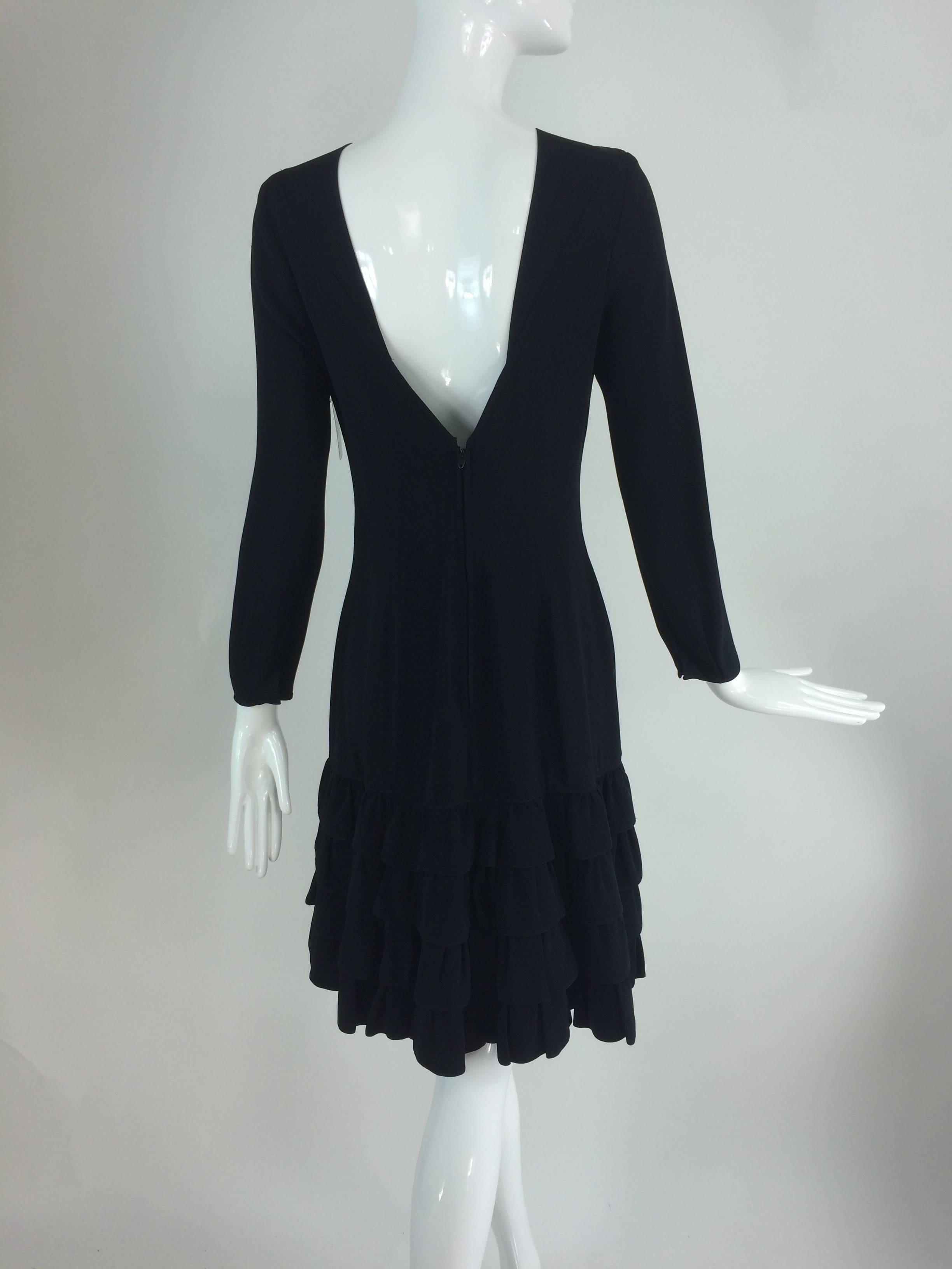 Rifat Ozbek black crepe dress with tiered ruffle hem 1980s...Princess seamed dress in black gabardine, with top stitched seams this dress has subtle details that give it a chic look...There are inset panels at the neckline that form a slightly