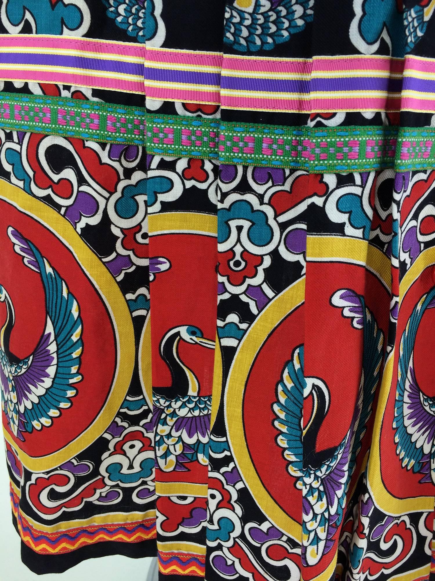 Giorgio Sant'Angelo 4 U mix print maxi skirt 1970s...Black cotton twill with a vivid print of flying cranes forms the body of this pleated skirt, the deep hem is a coordinating print in reds & golds with the same bird with its wings up...The waist