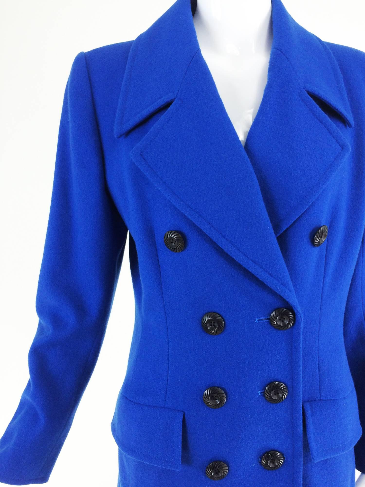 Yves St Laurent Rive Gauche bright blue wool pea coat 1990s...Bright blue 100% wool double breasted pea coat with wide notched lapels, hip flap pockets and darted waist...The long sleeves have 3 buttons at each cuff...Fits like a S-M...

In