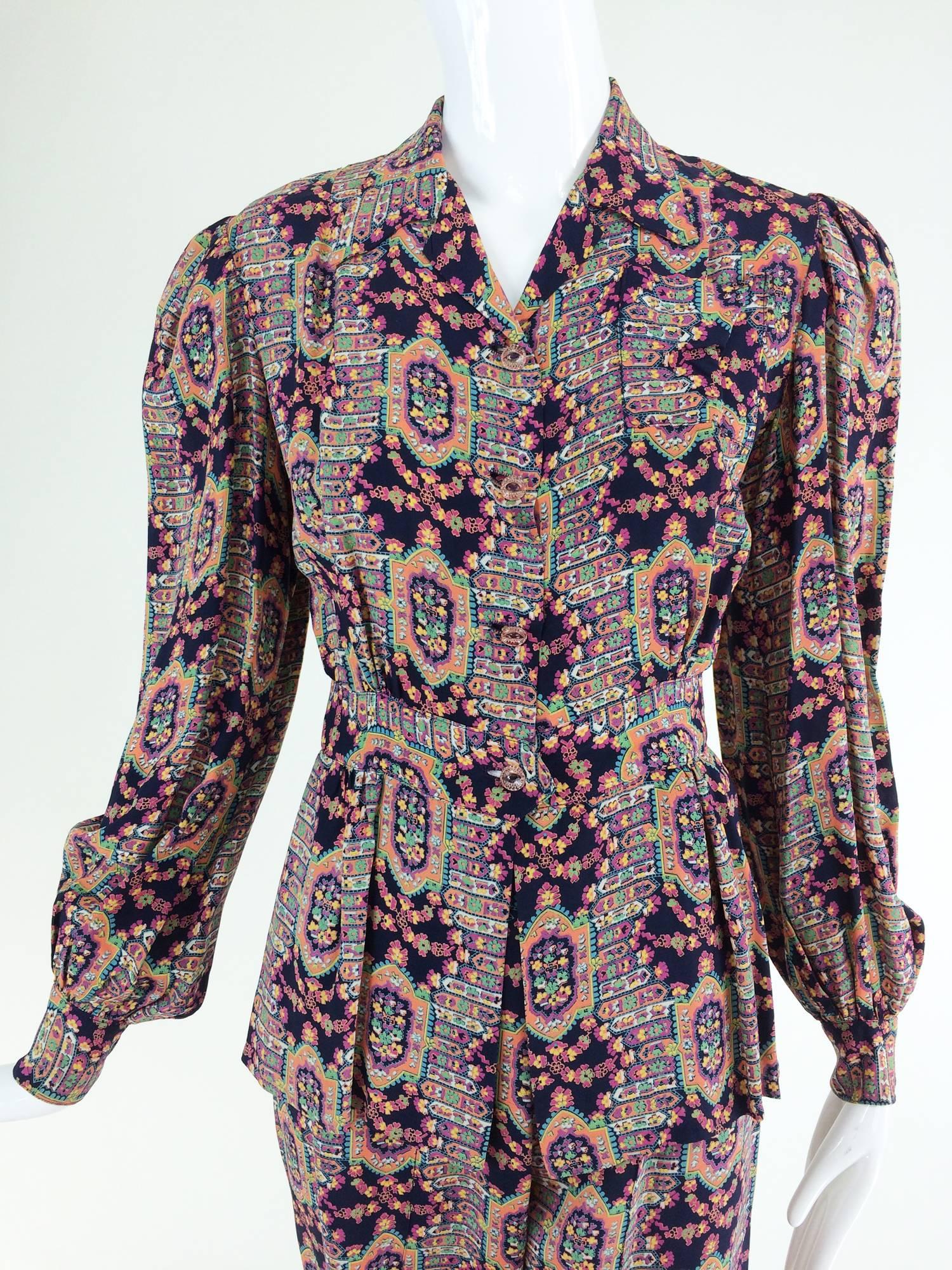 1940s printed rayon pajama dressing...Well made pajama set in a floral print set on a dark navy background...The long sleeve top closes at the front with pale pink clear glass buttons, notched lapel collar, banded waist with a peplum, the long