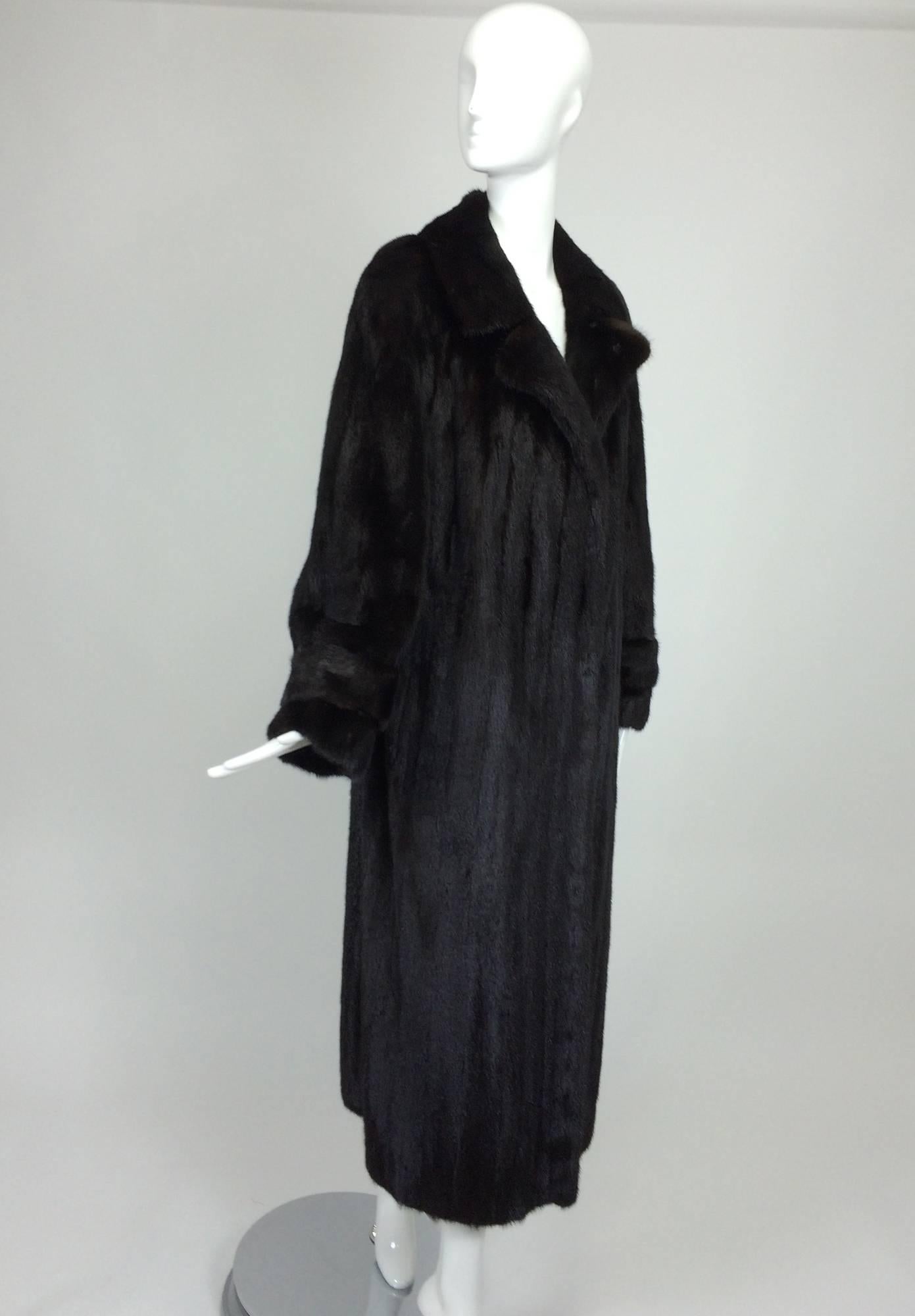 Black full length mink fur coat belt back 1990s Lord & Taylor...Beautiful, full length mink fur coat in black, with notched collar lapels, long full belted sleeves, coat closes at the front with fur hooks, the back features a low 1/2 belt...Fully