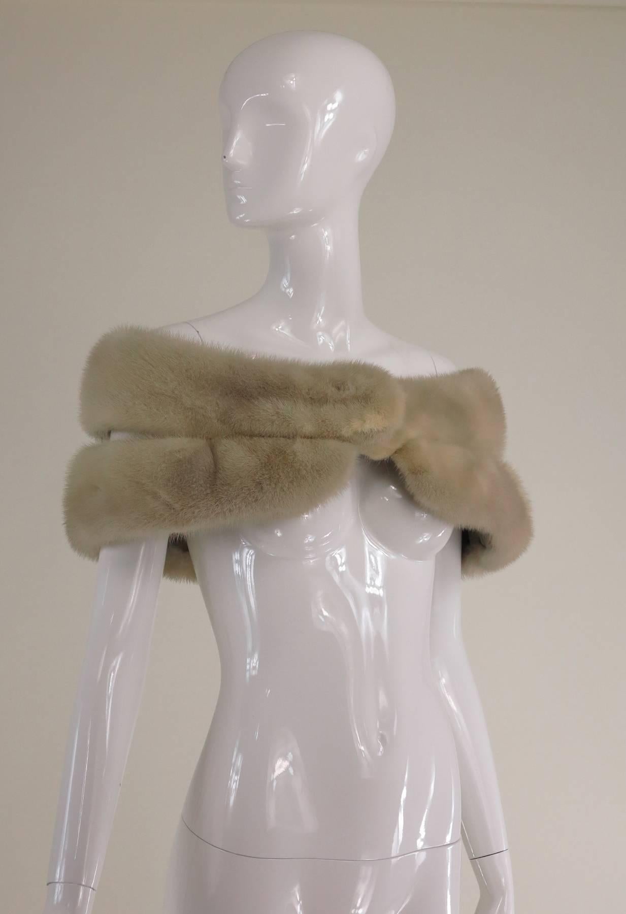  Double mink stole in champagne from the 1950s...This stole can be closed a couple of different ways, we've only shown one...Beautiful champagne mink in two layers which are connected with tailors bars, each is lined in silver grey velvet (there are