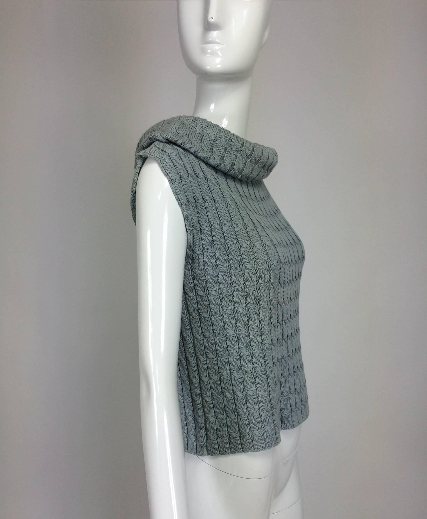 Zoran blue-grey cable knit sleeveless cowl neck sweater...100% cotton cable knit pull on sweater, unlined...Fits a size S-M

In excellent wearable condition... All our clothing is dry cleaned and inspected for condition and is ready to wear...Any