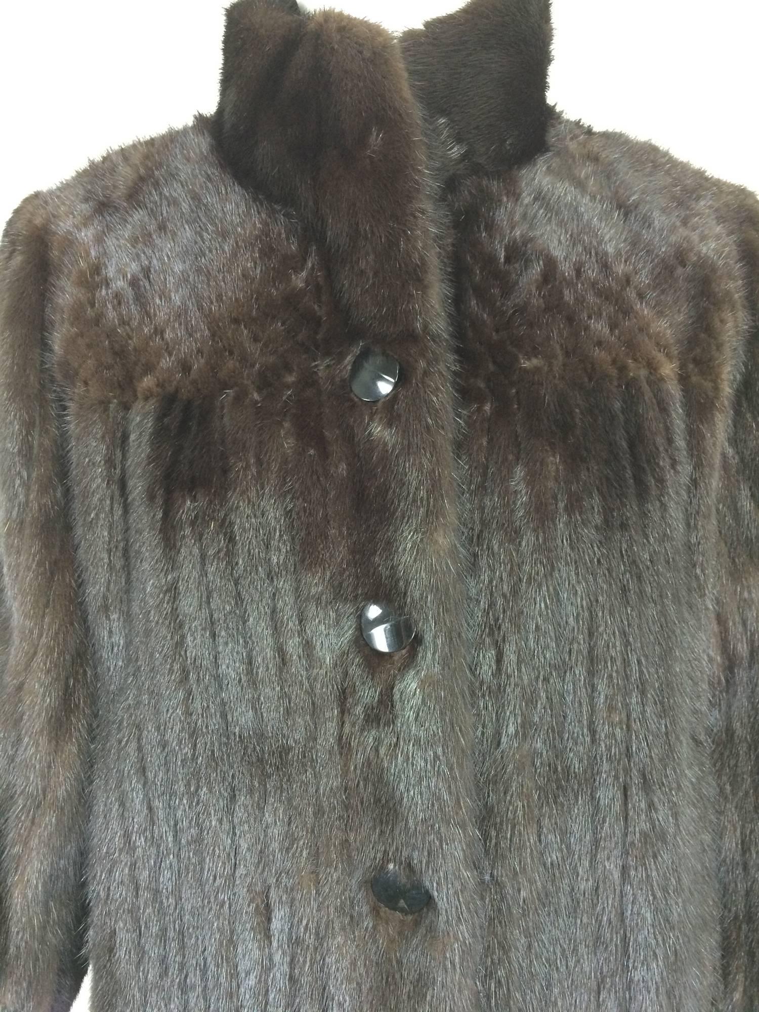Dark mink fur button cuff, patterend yoke mini coat 1990s...Very dark shiny, almost black mink mini coat or long jacket...The deep pieced mink yoke (front and back) is done in a small X pattern and has a very unusual look, the fur is done in narrow