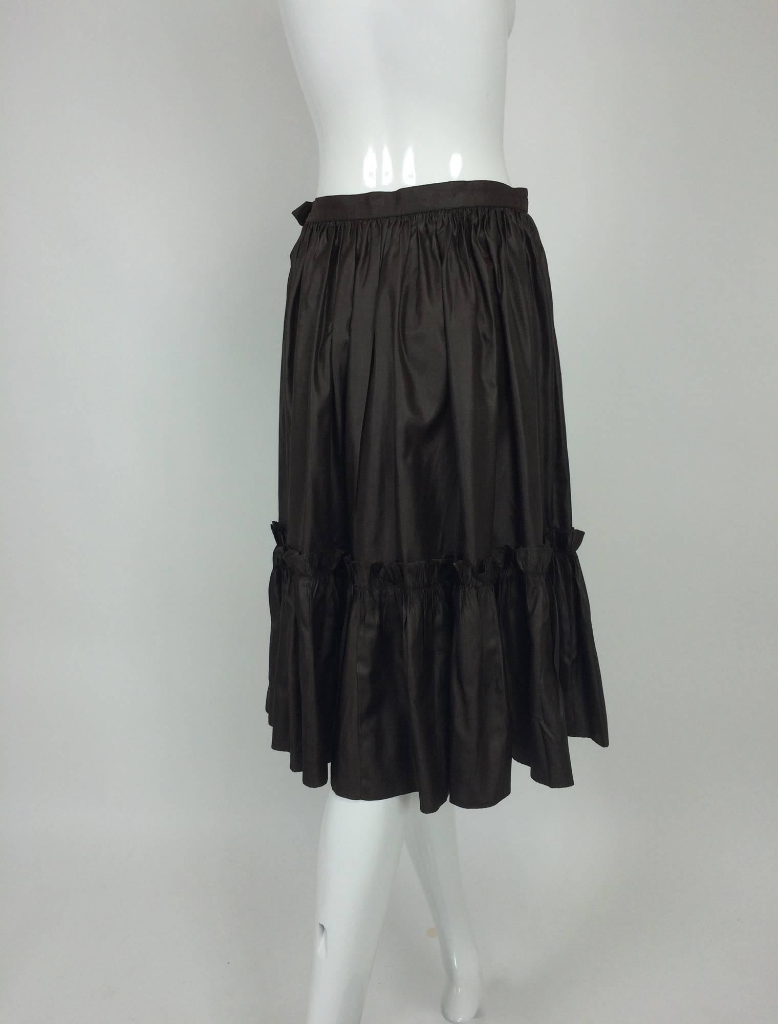 Yves St Laurent Rive gauche Chocolate Brown silk ruffle hem skirt 1970s...Fine silk ruffle hem skirt, banded waist with zipper closure...Barely if ever worn...Fits like a size small.

In excellent wearable condition... All our clothing is dry