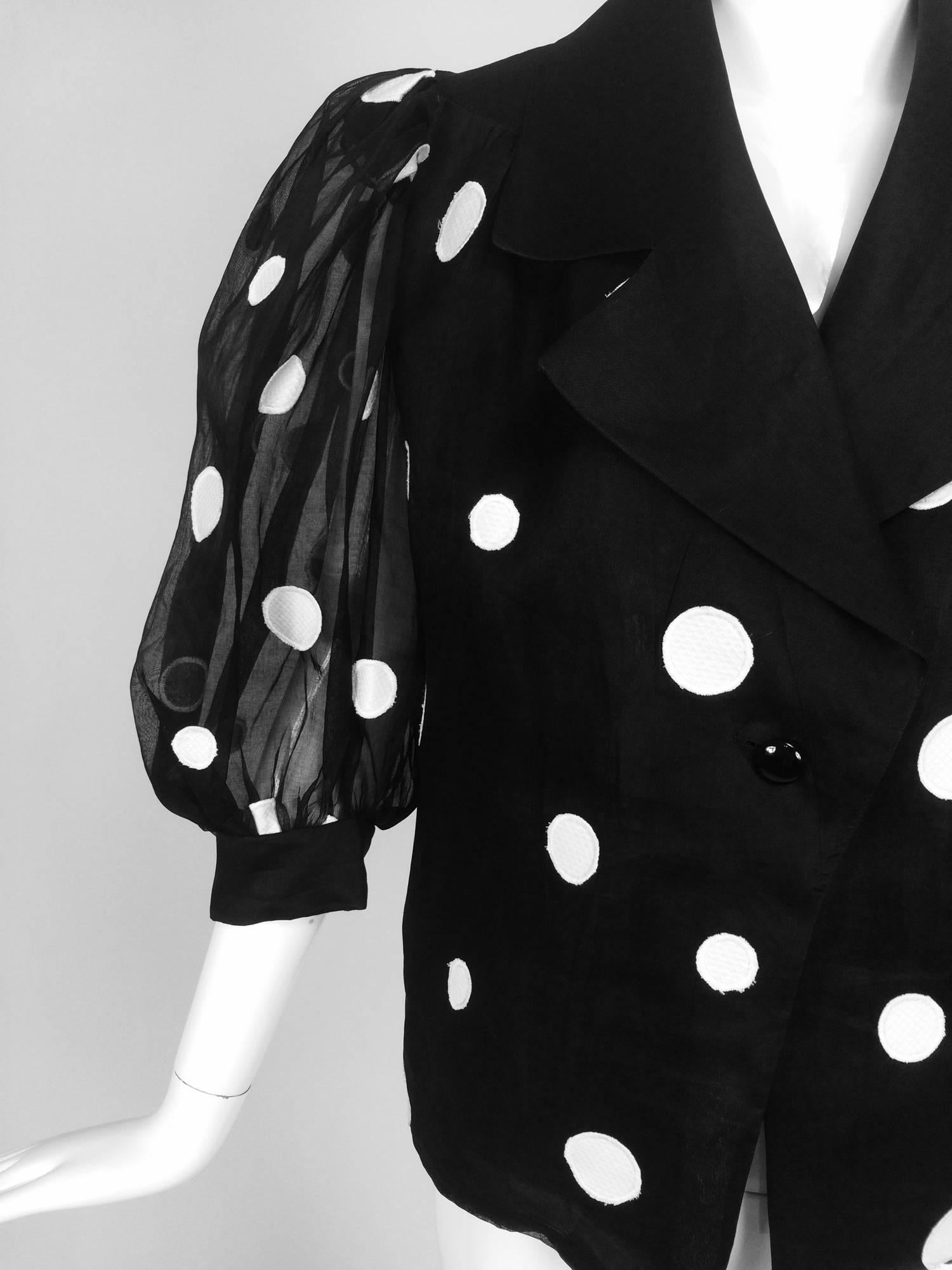 Givenchy black & white dot applique organdy blouse...Single button front closure blouse with full sheer unlined sleeves that have a banded and button cuffs...Notched lapels, V font neckline...The fabric is silk organdy, the appliques are white