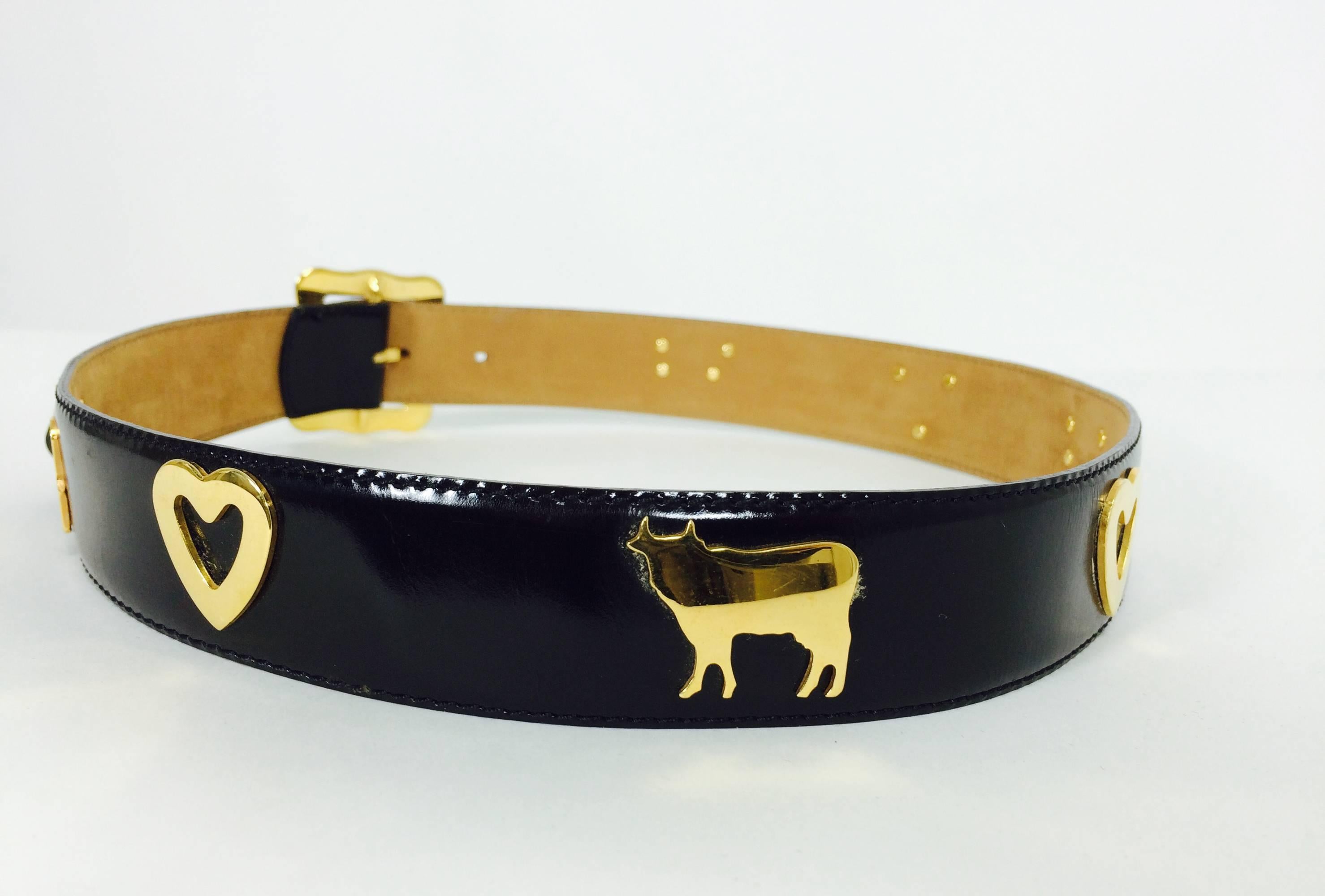 Moschino Redwall Swiss Appenzeller style belt with cows & hearts 1980s...Black leather belt with gold, hearts & cows with a large shaped buckle...Marked size 42 Italy...The belt is 1 1/4