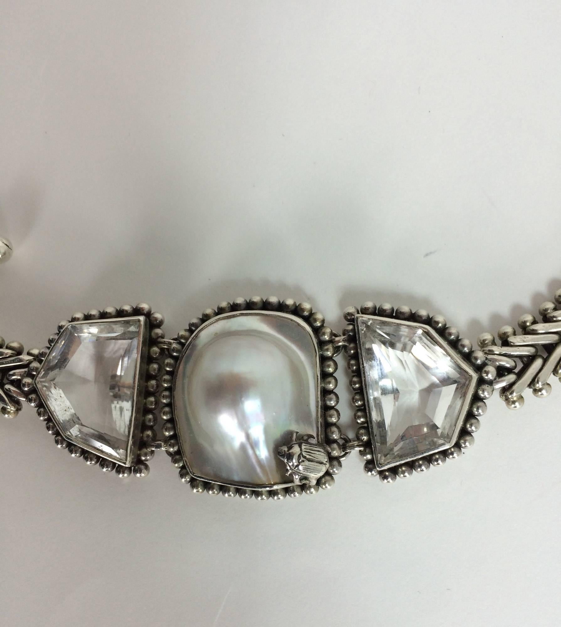 Stephen Dweck sterling silver white topaz & blister pearl bracelet marked one of a kind and dated 2000...Large and heavy sterling silver chain bracelet with a bezel set center blister pearl that has a sterling silver beetle mounted at the outside