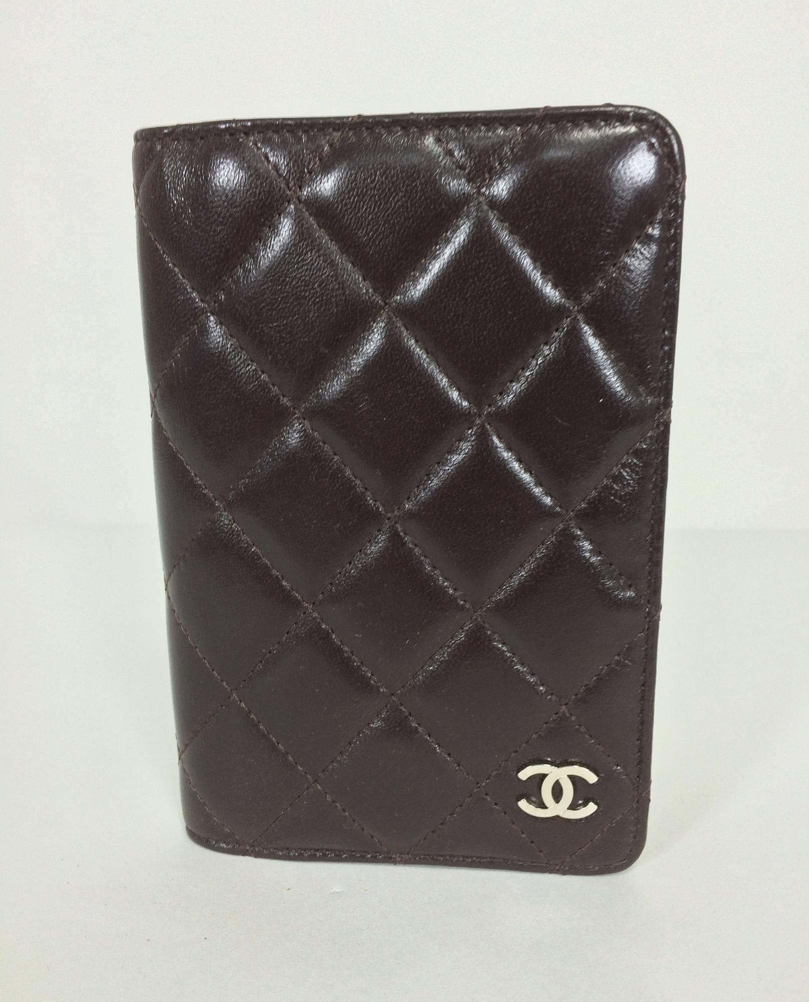 Chanel quilted leather datebook 2009 unused...Together with a Chanel paper note book...Chocolate brown soft quilted leather with double pockets (lined in brown faille) on the inside of the front cover and one compartment on the inside of the back