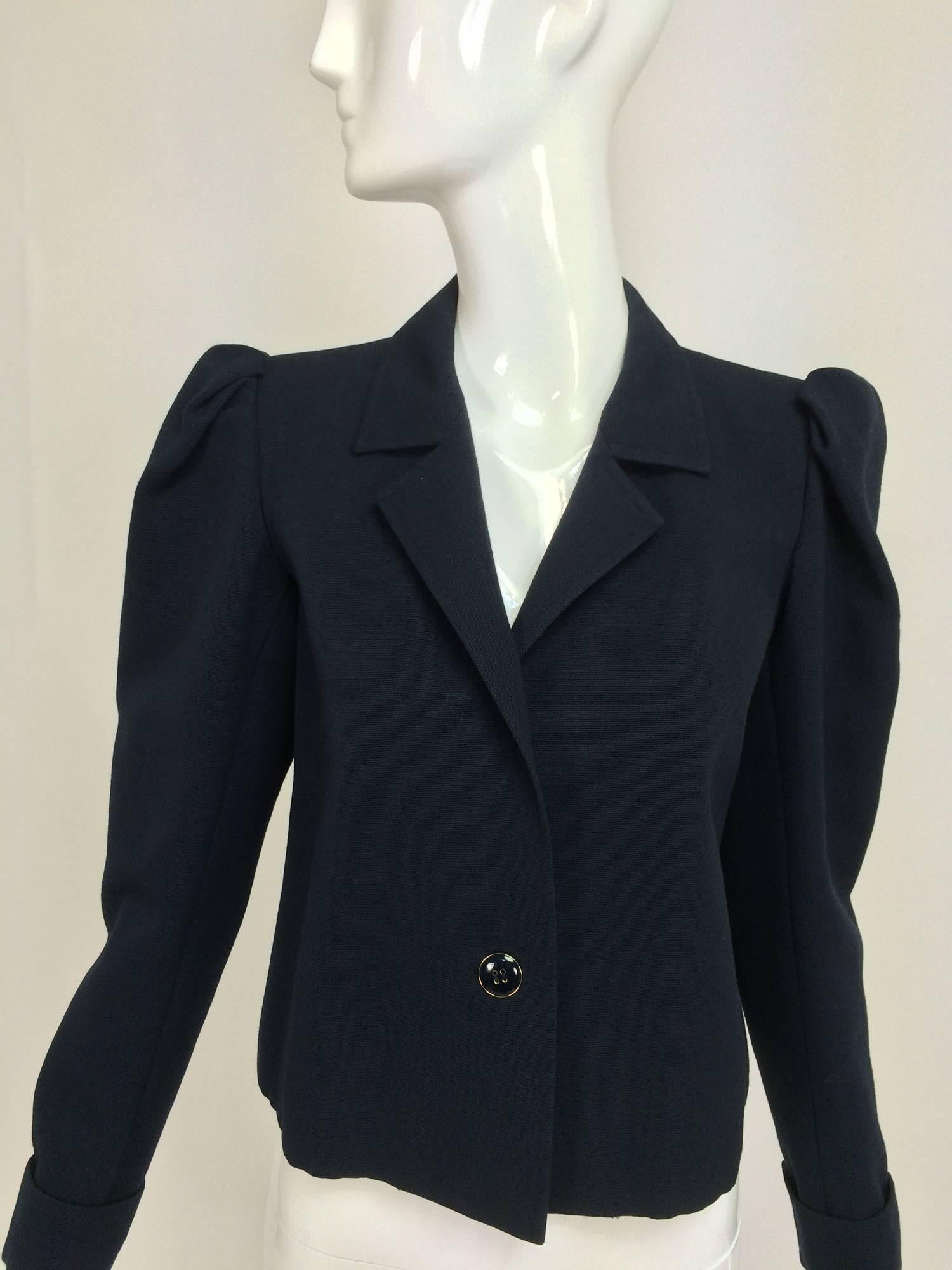 Yves St Laurent navy blue peaked shoulder cropped wool faille jacket 1980s...Great jacket for layering, cropped length, pleated peaked shoulder, the long sleeves have a turn back cuff with a hidden button...The narrow lapel jacket closes with a