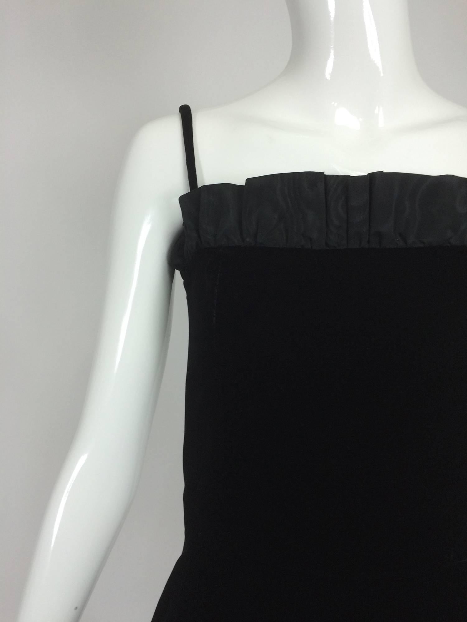 Yves St Laurent black velvet & taffeta fitted bodice flare hem cocktail dress from the 1980s...The long line bodice is black velvet, there is a narrow taffeta ruffle at the top edge...The gathered flared skirt begins at the lower hip...Narrow velvet