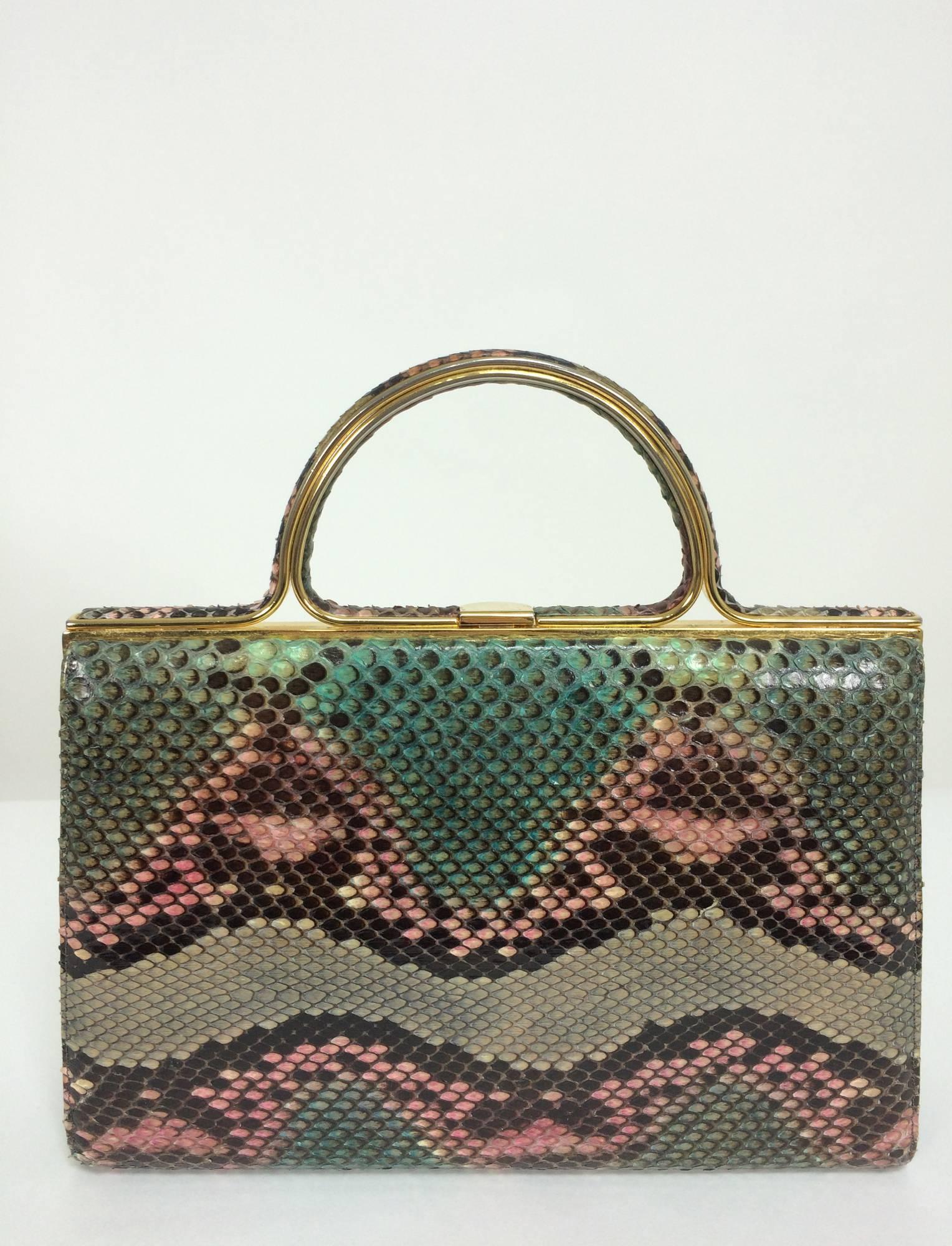 Judith Leiber pink & green snakeskin frame handbag...Pink and green with cocoa and chocolate brown snakeskin handbag, the handle is gold with a bezel of snakeskin...Perfect for afternoon and evening...Inside is lined in lavender faille, there is a