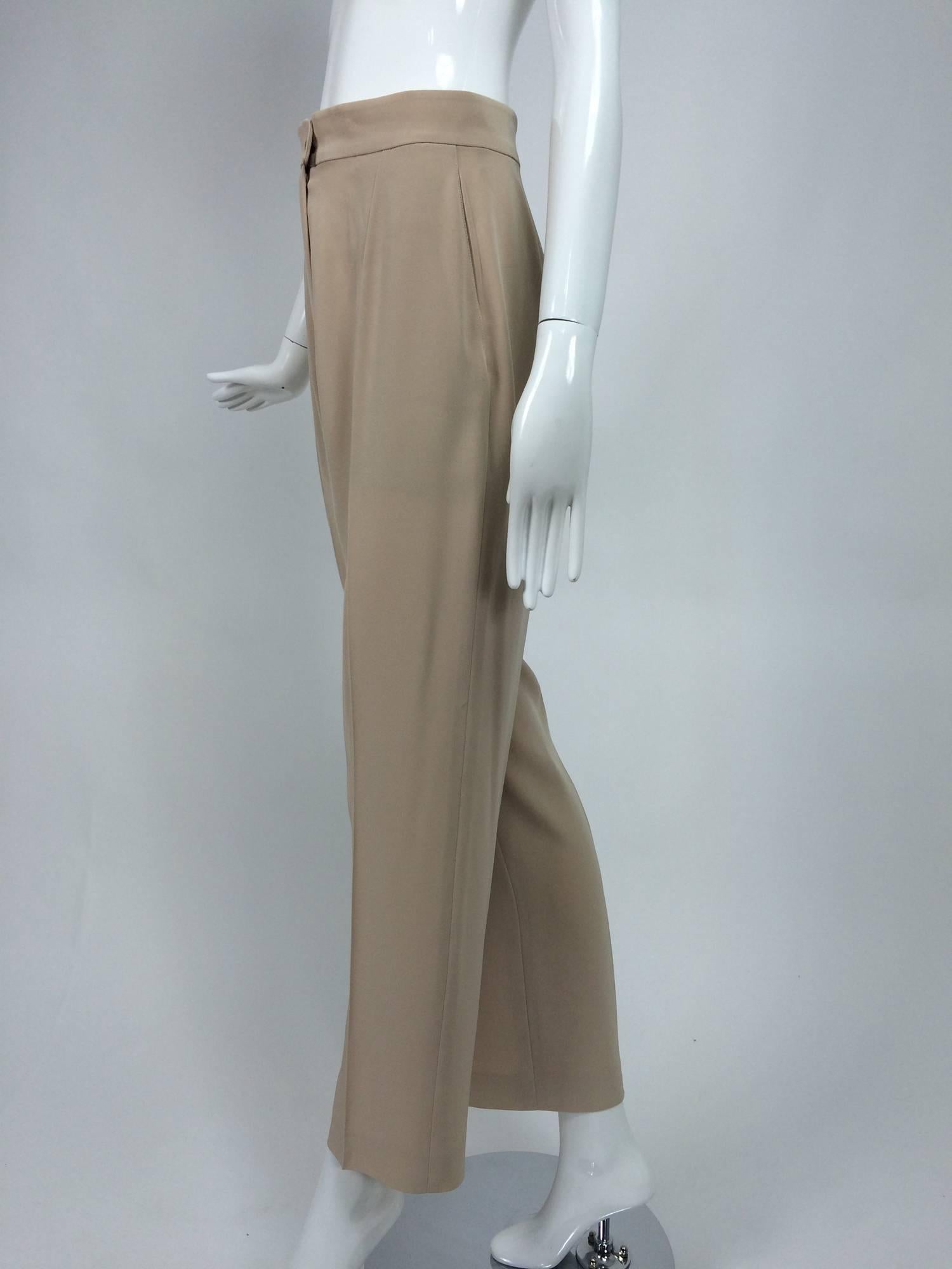 Chanel taupe banded waist fly front trouser 38...Classic flat front trouser with a banded waist, button and fly front closure...Side pockets...In barely, if ever, worn condition...Marked size 38

In excellent wearable condition... All our clothing