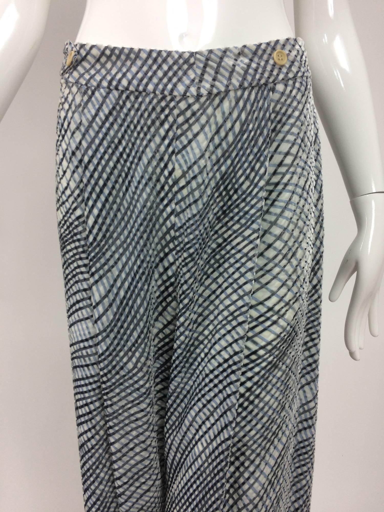 Giorgio Armani lattice pattern cut velvet wide leg trouser shades of gray...Wide leg trouser with side buttons and tabs at each waist side...Relaxed pleat at each front...Fully lined...Closes with a side zipper and buttons...Silk velvet with