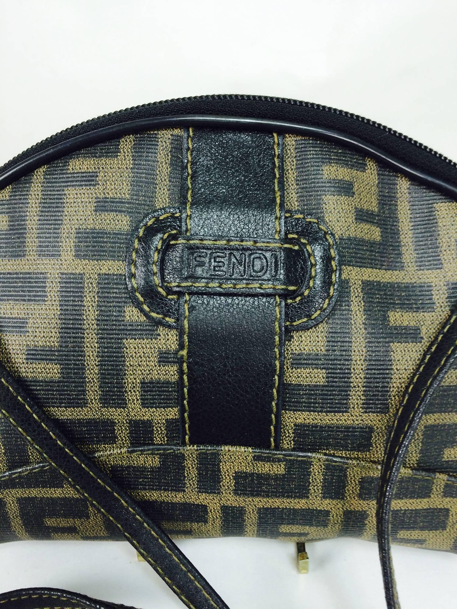 Fendi logo canvas cross body small hand bag 1980s...Classic Fendi logo canvas bag with long thin knotted cross body strap...Zipper top, with a single open compartment inside...Excellent condition.
Measurements are:
8 1/2