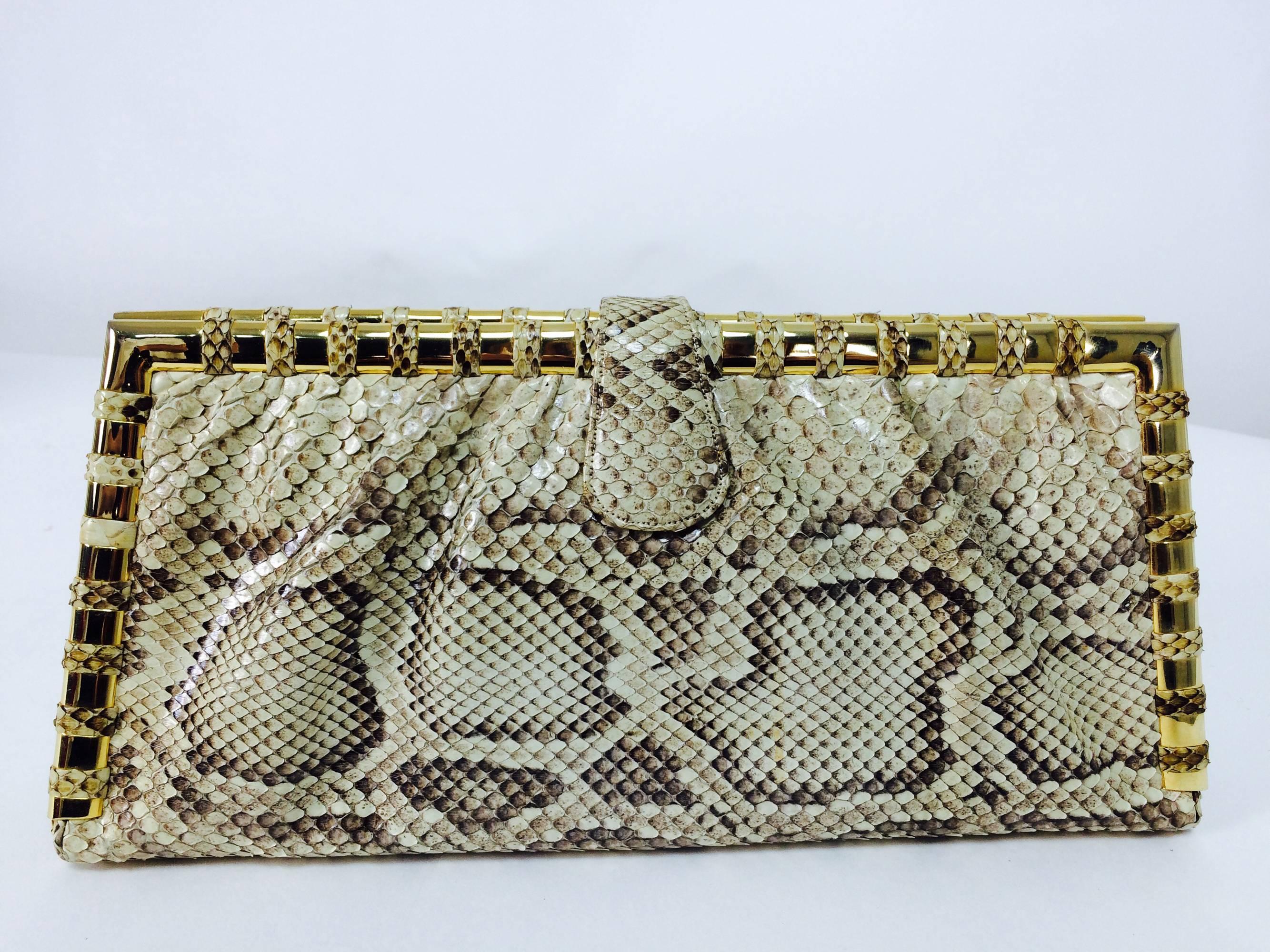 Judith Leiber natural python gold frame snake chain handbag or clutch...Gold frame handbag carry as clutch or shoulder bag...Sleek bag with gold metal frame that is wrapped in bands of snakeskin...With optional double gold snake chanin...Lined in