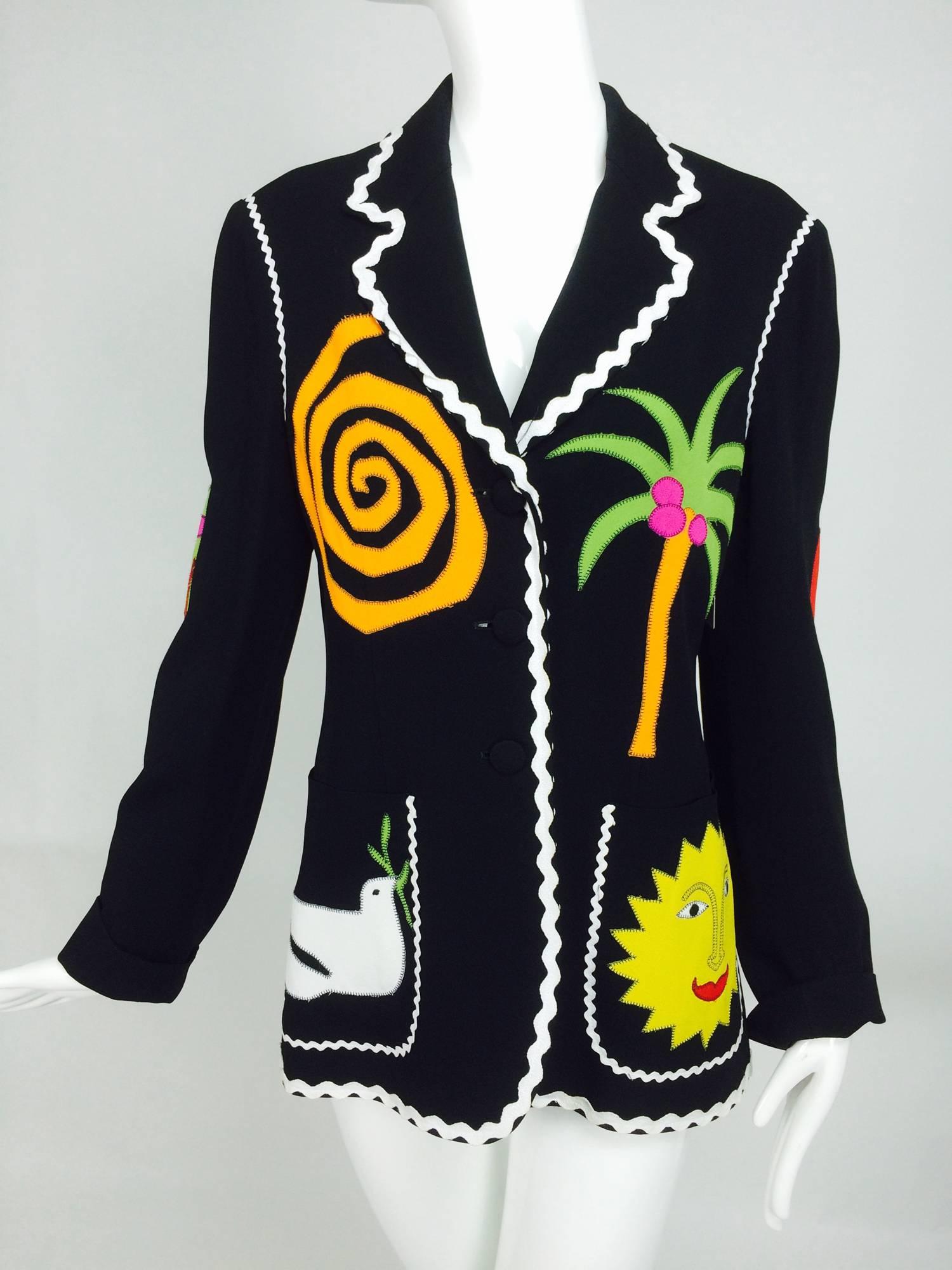 Moschino Cheap & Chic lucky 13 chili pepper horseshoe jacket 1980s...Such a great jacket with loads of appliques and white rick rack trim...Black single breasted jacket has hip front patch pockets appliqued with a sun face and a peace dove...The