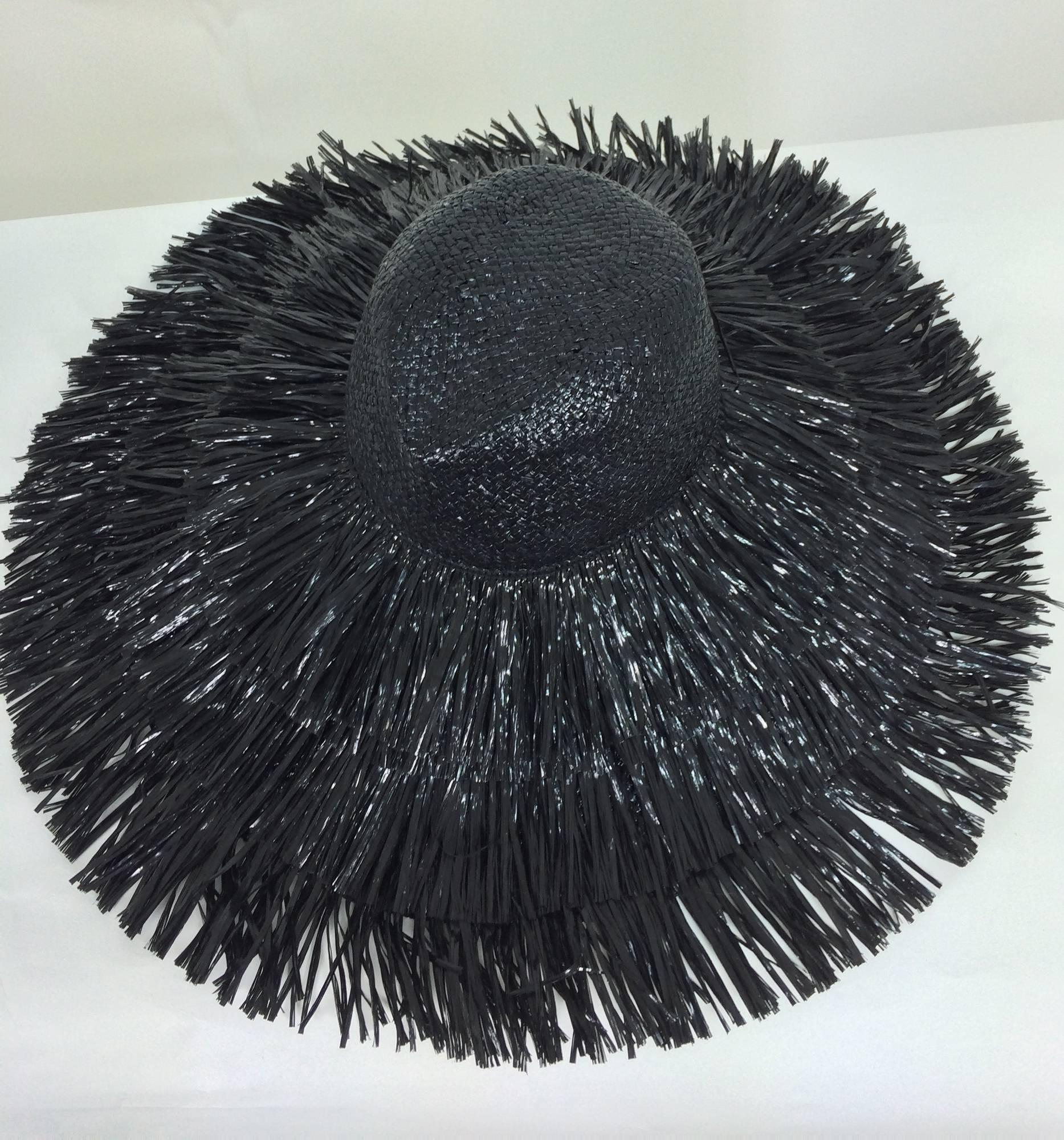 Vintage Eric Javits glazed black straw shaggy fringe wide brim hat 1980s...This is a great hat with a very retro 60s look...Glazed black straw hat has a shaped crown, the brim is covered in shaggy shinny black raffia straw...Wide black gros grain