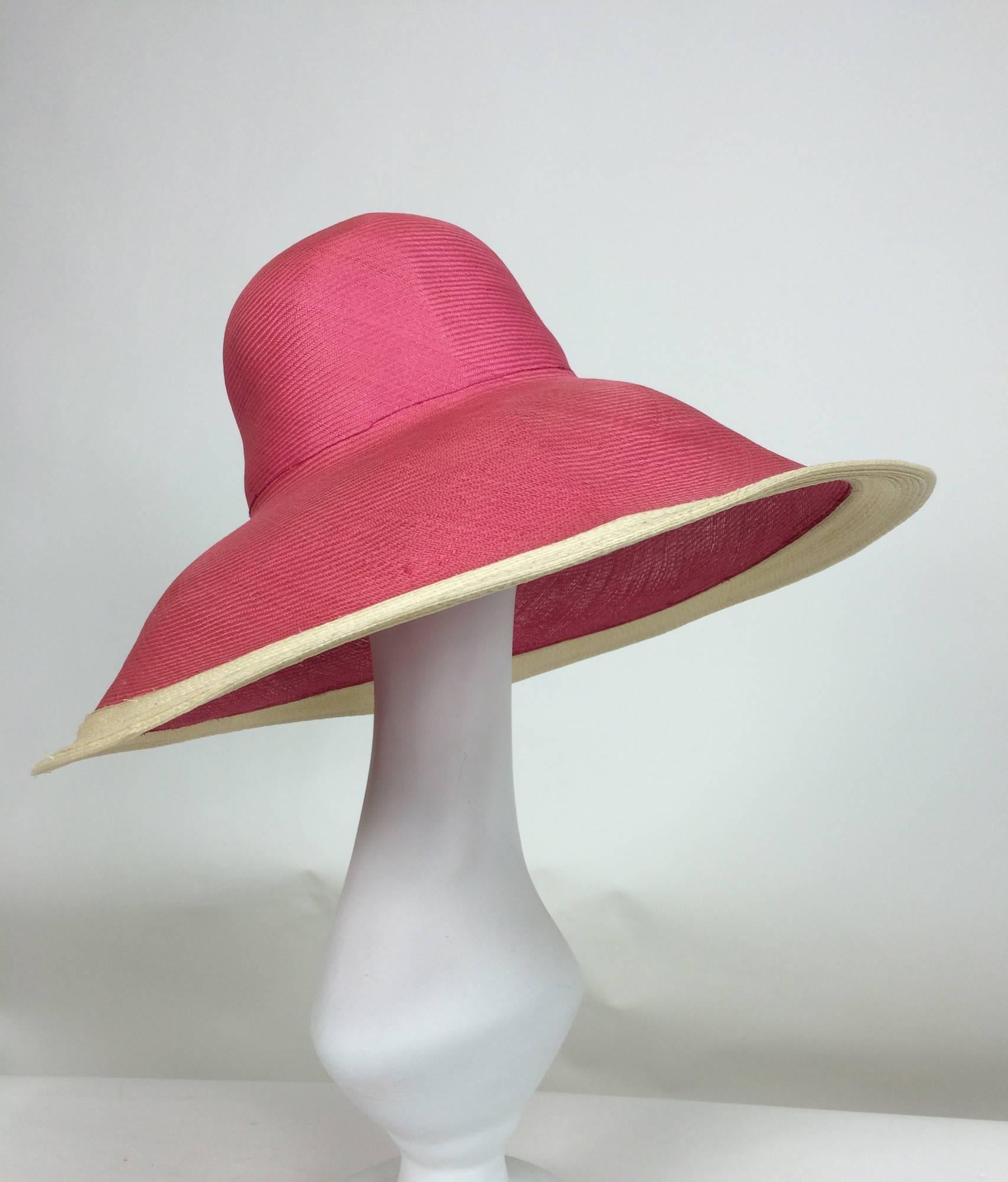 Deep brim finely woven straw hat with a high crown...The brim is meant to be turned down, the edge band is trimmed in natural straw...Unworn

In excellent wearable condition... All our clothing is dry cleaned and inspected for condition and is