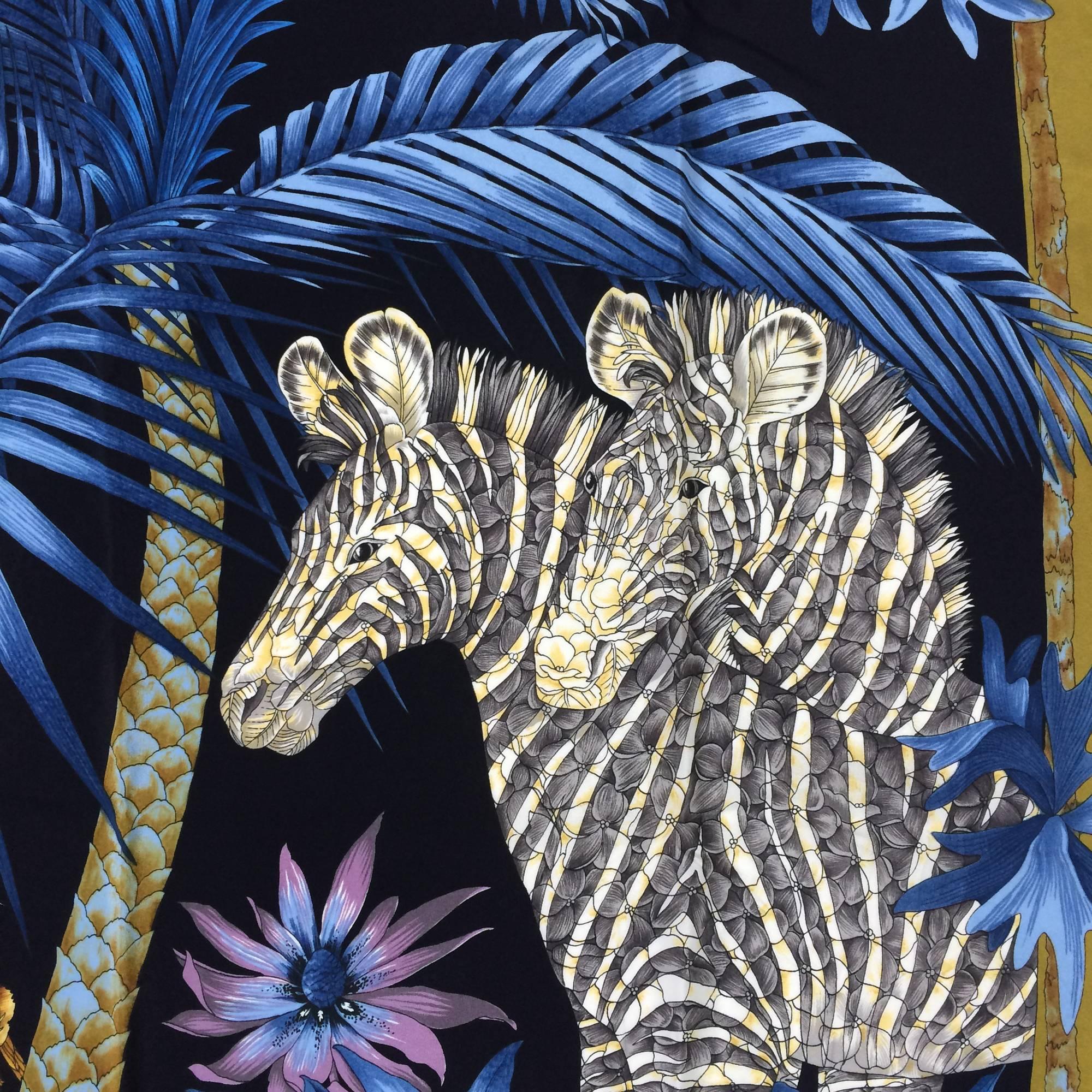 Vintage Ferragamo blue jungle silk scarf with a pair of golden lions and zebras under a blue palm tree, the scarf border is a beautiful shade of  split pea soup green...This silk scarf has the texture of a very fine crepe...Hand rolled edge...33