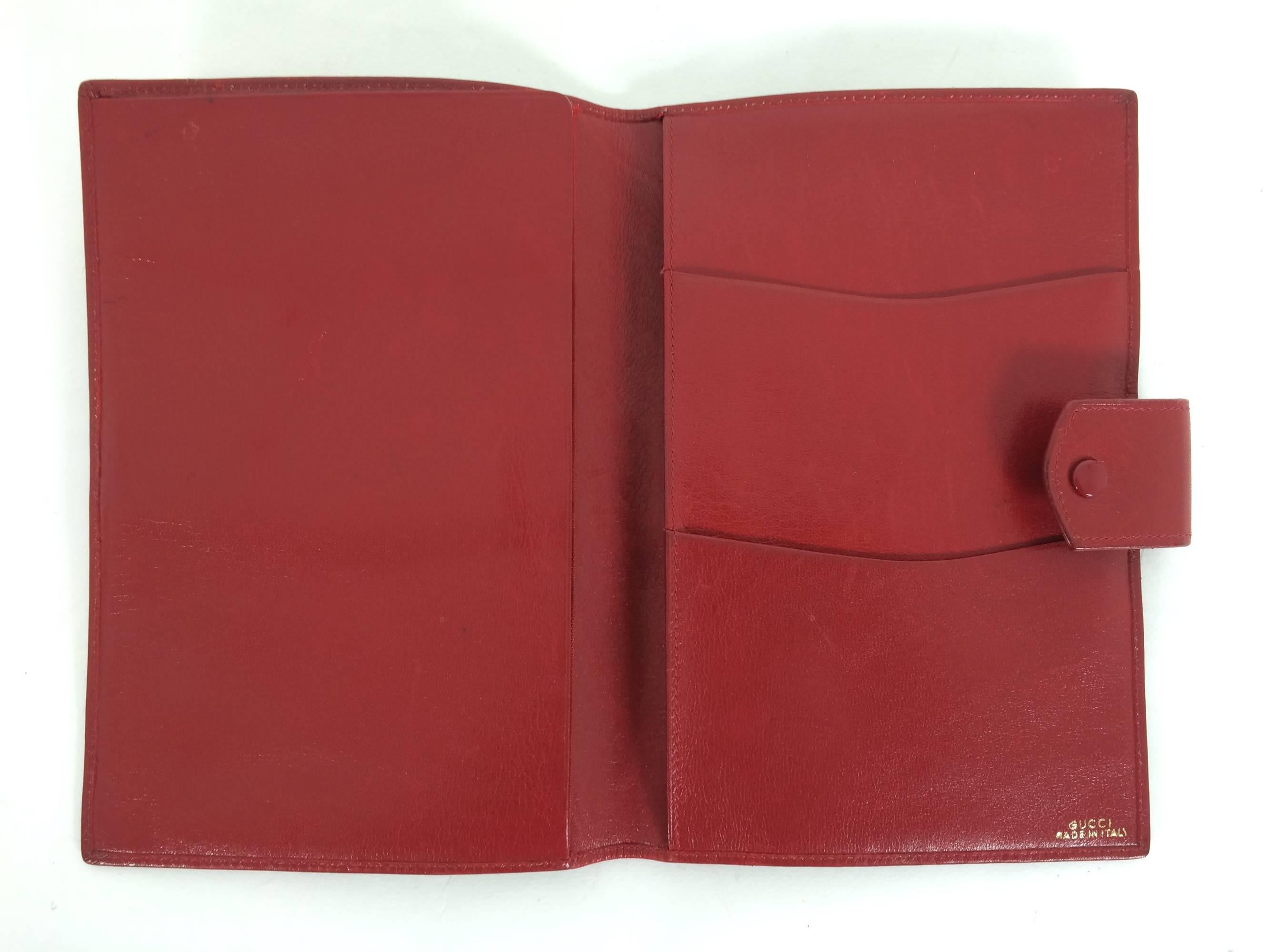 Vintage Gucci red leather passport case wallet 1970s...Beautiful soft glazed leather fold over passport case/ wallet, one side has a flap that will hold a passport, with an open pocket behind for cash, the other side has 2 open compartments on one