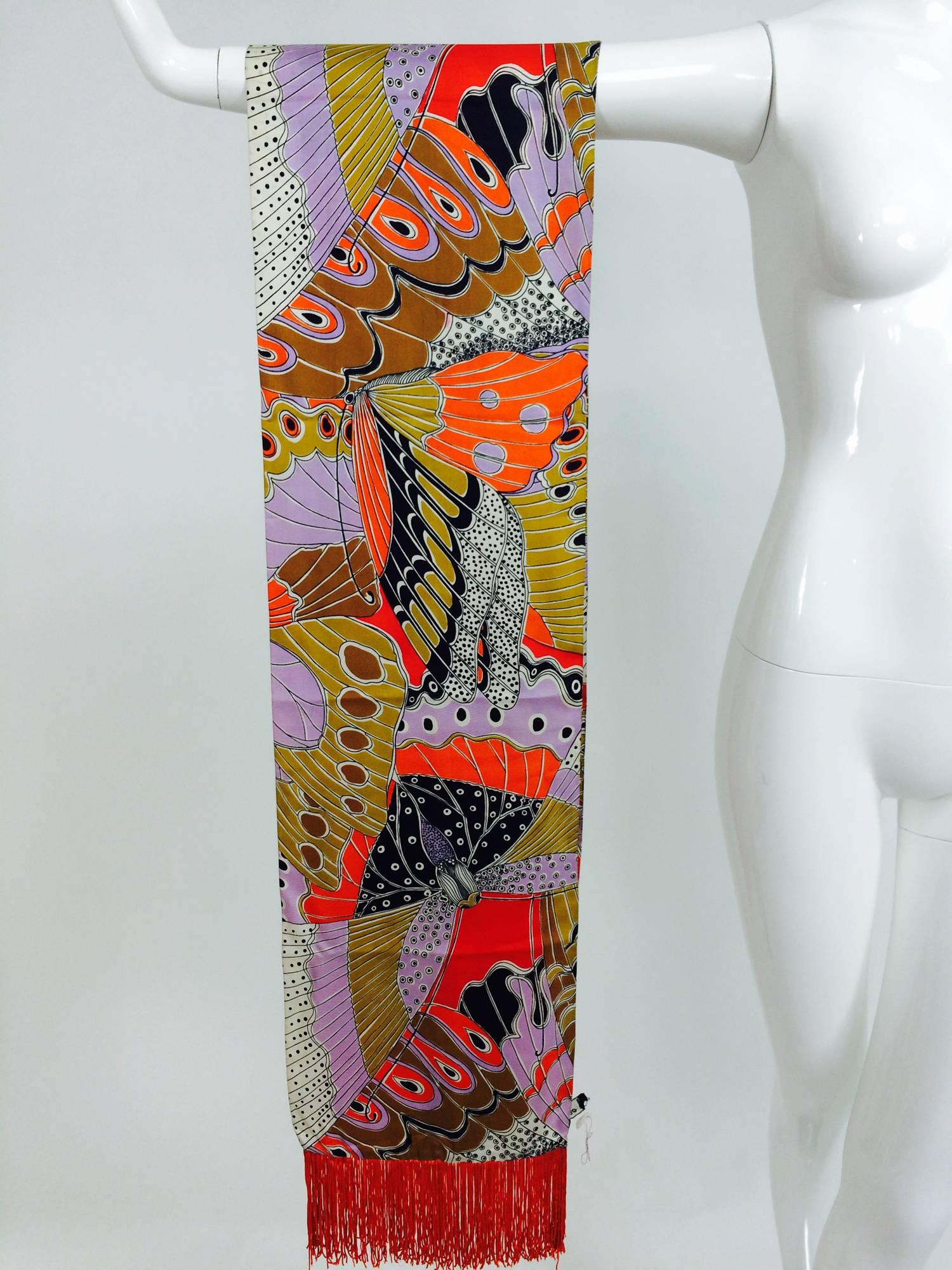 Vintage Doro wide & long 100% silk fringe graphic butterfly scarf 1960s...Beautiful vivid colours with an all over print of butterflies...Each end has a deep orange fringe...Labeled Doro 100% silk.
Measurements are:
10 1/2