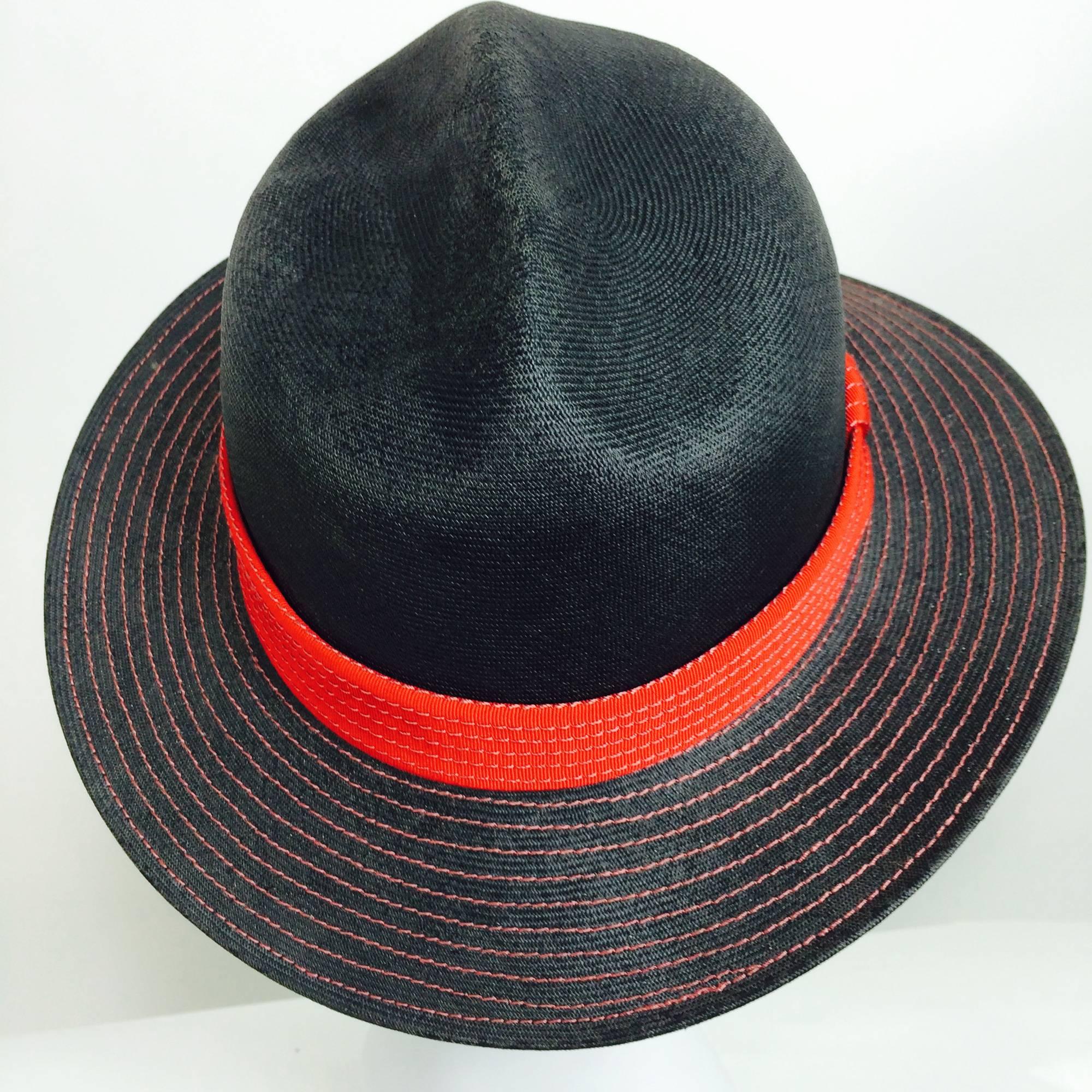 Vintage Galanos matte black straw with red decorative stitching and red gros grain band...Never worn with the original inventory tag...From a collection of hats from the estate of socialite & Galanos pal Betsy Kaiser...Fedora hat with a creased