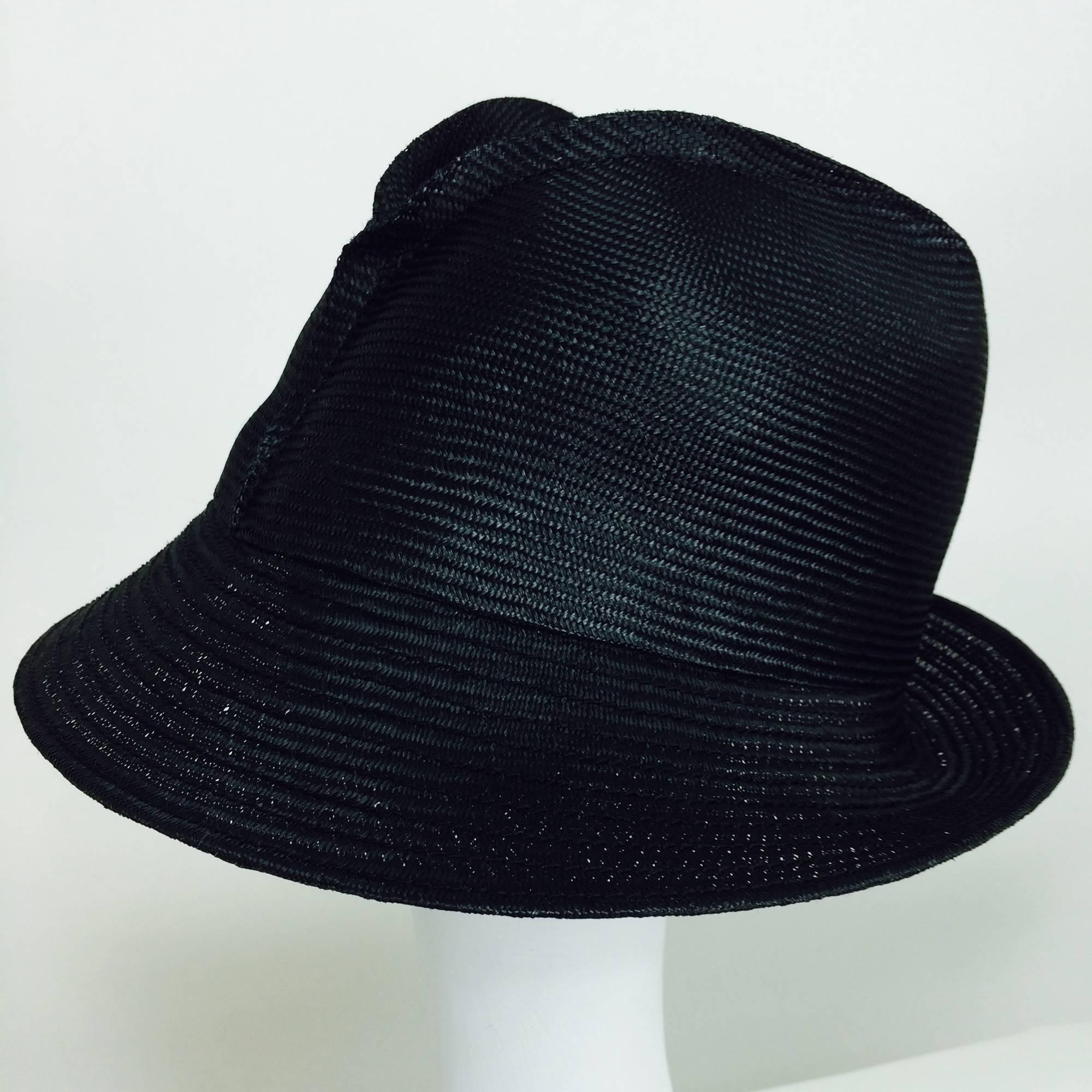 Vintage outwardly seamed glazed black straw cloche 1960s...A hat with a slightly 1920s flapper shape but very modern...High crown sits low on the head...The outside front (crown) of the hat has shaped pleating (forming an abstract Y) purposely