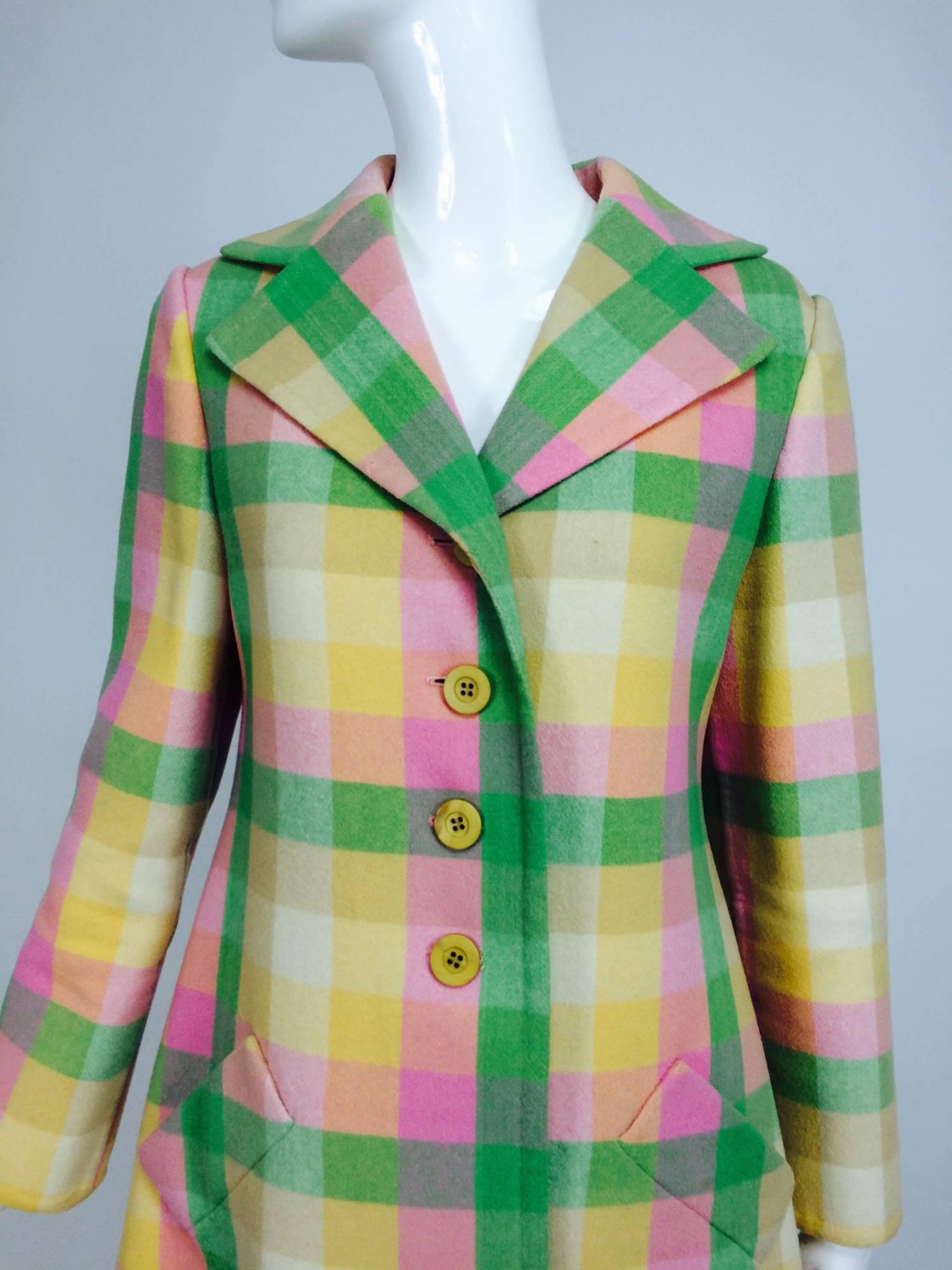 From the early 1970s a beautiful Bill Blass classic single breasted coat of medium weight double faced wool, executed in perfectly matched plaid...The plaid in pastel spring colours, from the days when spring coats were de rigueur...Long sleeve coat