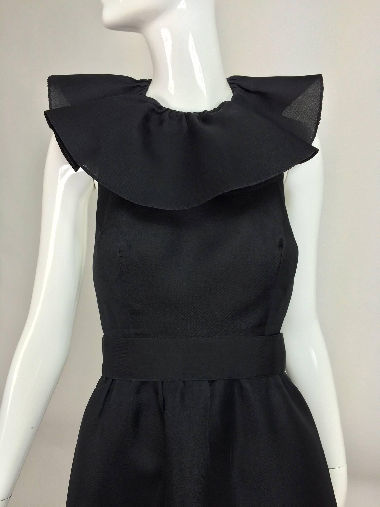 Vintage Nina Ricci black silk organza halter neck evening dress 1990s...Dramatic halter evening dress with a ruffle neck and a large bow at the neck back, low open back to waist...The skirt is lightly gathered at the waist and falls to a deep full