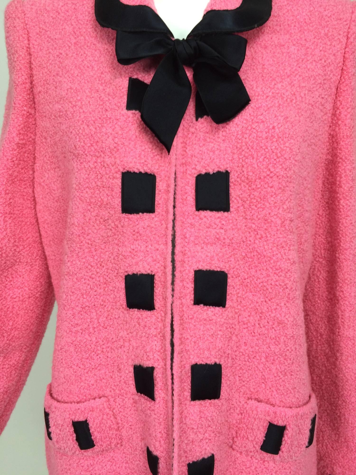 Vintage Adolfo pink & black ribbon trim boucle jacket 1970s...Loose fitting jacket closes at the neck front with a hidden hook and a black satin bow tie (snaps on), the jacket is open below with no fastenings...Trimmed in black satin woven ribbon at